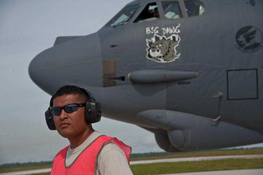 ANDERSEN AIR FORCE BASE, Guam-Members of the 69th Expeditionary Bomber Squadron, deployed in from Minot Air Force Base, North Dakota, perform pre-flight checks on a B-52 Stratofortress aircraft to participate in Exercise Pitch Black here August 2. PB 12 is a multilateral exercise conducted between the U.S. Marine Corps and Australian Defense Force, Royal Thai Armed Forces, Singapore Armed Forces, New Zealand Defense Force, Malaysian Armed Forces, French Armed Forces, British Armed Forces, Indonesian National Armed Forces and a component operating under the North Atlantic Treaty Organization in order to develop greater interoperability and a seamless response to regional crises. Greater collaboration between partner militaries strengthens regional peace, stability and prosperity.  (U.S. Air Force photo by Staff Sgt. Alexandre Montes)