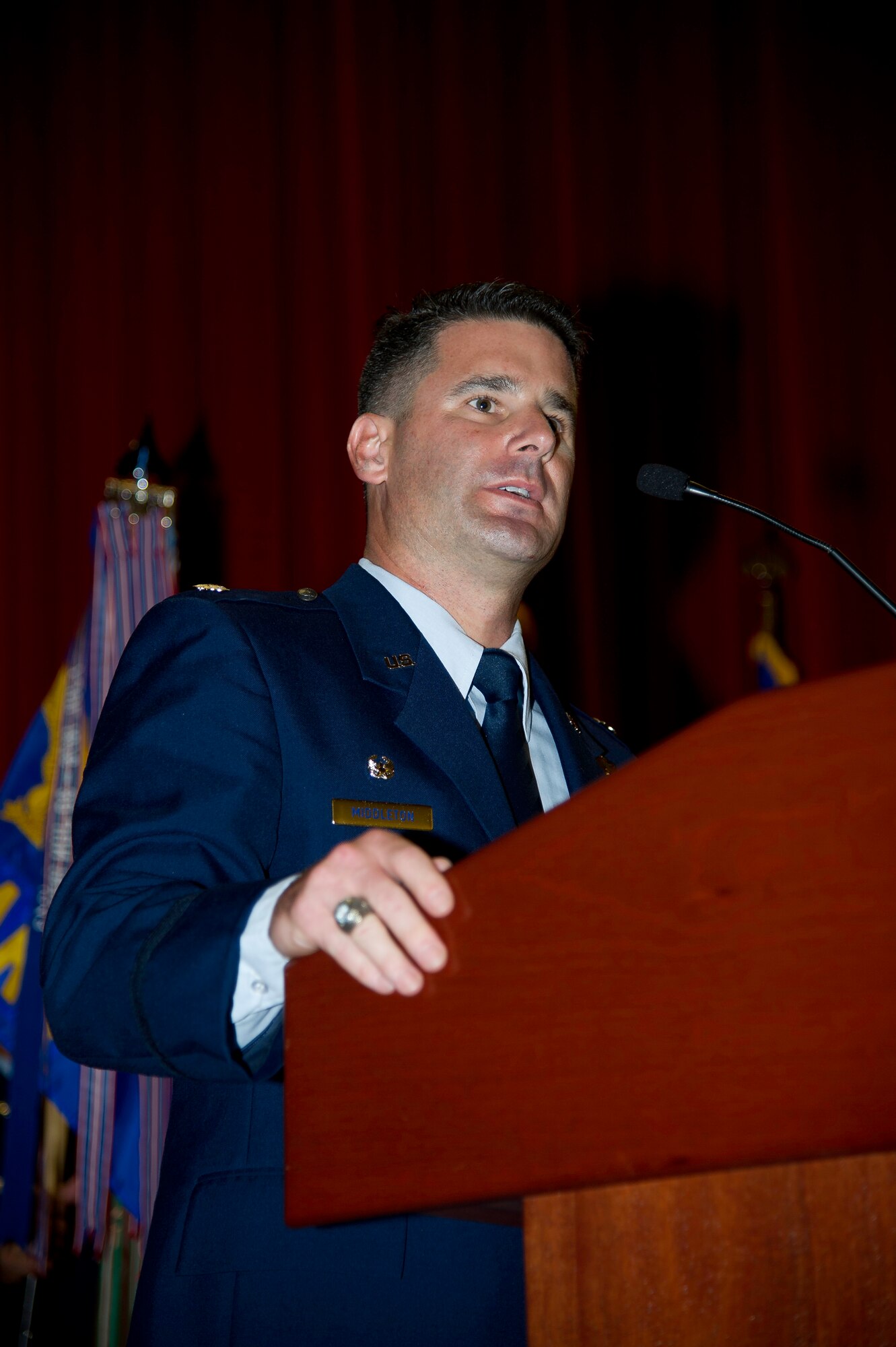 Lt. Col. Scott Minton, 912th Air Refueling Squadron incoming commander, takes command of the 912th ARS from Lt. Col. Brice Middleton, 912th ARS outgoing commander, July 21, during a change of command ceremony in the Cultural Resource Center. Col. Shawn Teagan, 92nd Operations Group commander, Fairchild AFB, Wash., presided over the event. Senior Master Sgt. Eric Butt, 912th ARS first sergeant, holds the guidon which symbolizes the transfer of authority from the old to the new commander. (U.S. Air Force photo by Staff Sgt. Matthew Smith) 