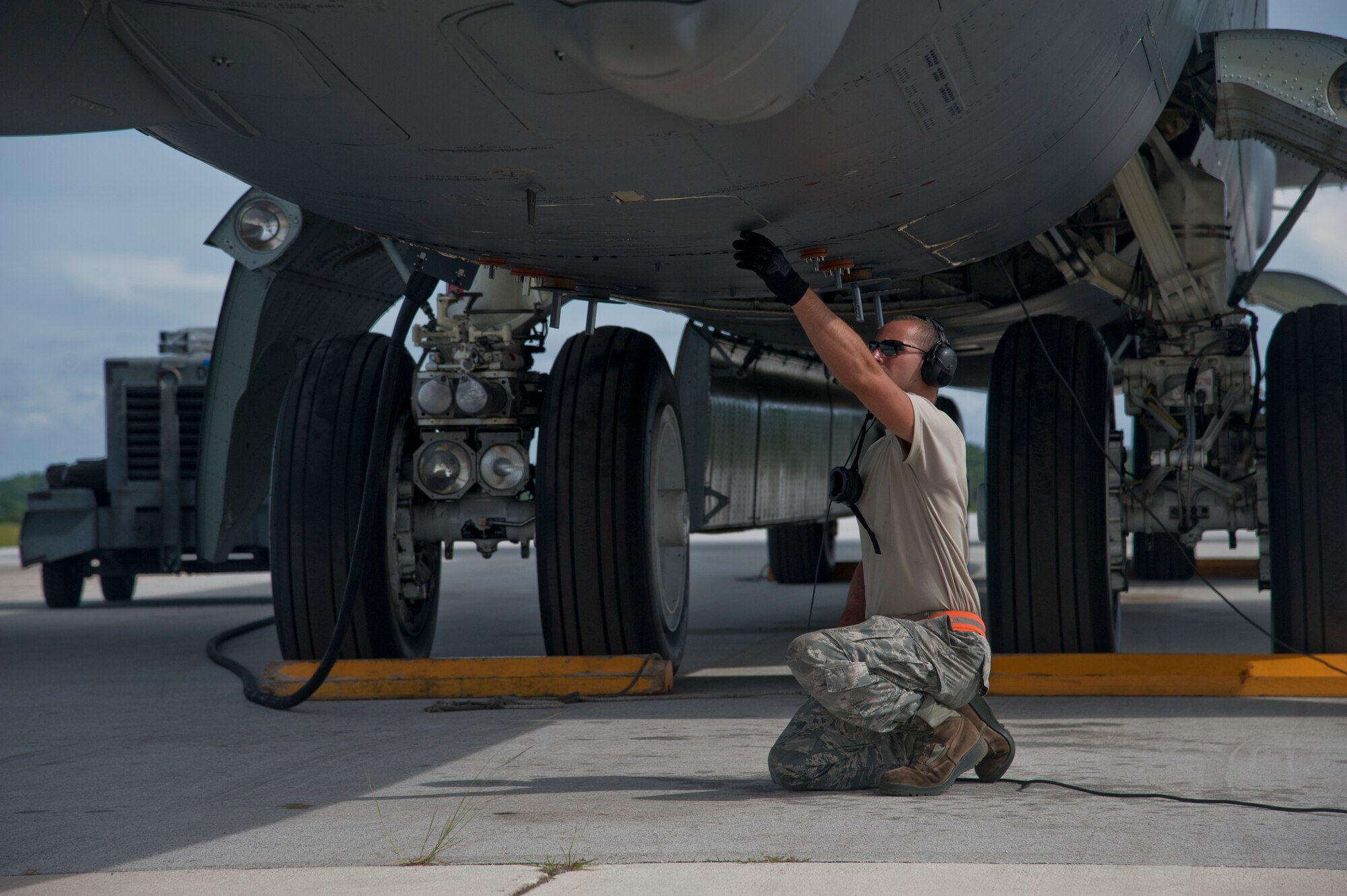 ANDERSEN AIR FORCE BASE, Guam-Members of the 69th Expeditionary Bomber Squadron, deployed in from Minot Air Force Base, North Dakota, perform pre-flight checks on a B-52 Stratofortress aircraft to participate in Exercise Pitch Black here August 2. PB 12 is a multilateral exercise conducted between the U.S. Marine Corps and Australian Defense Force, Royal Thai Armed Forces, Singapore Armed Forces, New Zealand Defense Force, Malaysian Armed Forces, French Armed Forces, British Armed Forces, Indonesian National Armed Forces and a component operating under the North Atlantic Treaty Organization in order to develop greater interoperability and a seamless response to regional crises. Greater collaboration between partner militaries strengthens regional peace, stability and prosperity.  (U.S. Air Force photo by Staff Sgt. Alexandre Montes)