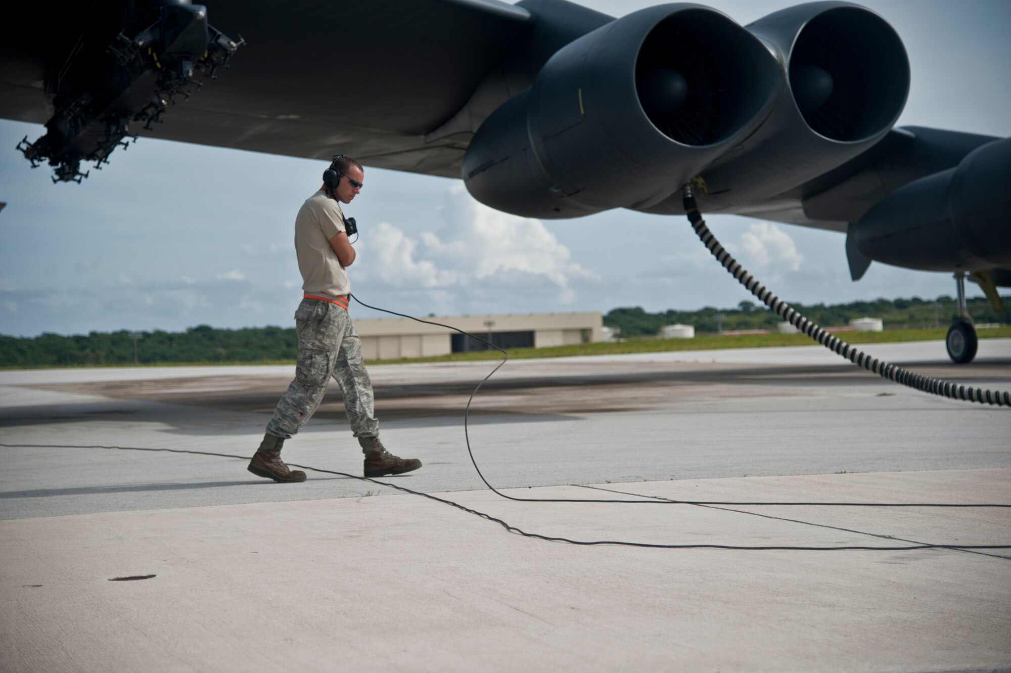 ANDERSEN AIR FORCE BASE, Guam-Members of the 69th Expeditionary Bomber Squadron, deployed in from Minot Air Force Base, North Dakota, perform pre-flight checks on a B-52 Stratofortress aircraft to participate in Exercise Pitch Black here August 2. PB 12 is a multilateral exercise conducted between the U.S. Marine Corps and Australian Defense Force, Royal Thai Armed Forces, Singapore Armed Forces, New Zealand Defense Force, Malaysian Armed Forces, French Armed Forces, British Armed Forces, Indonesian National Armed Forces and a component operating under the North Atlantic Treaty Organization in order to develop greater interoperability and a seamless response to regional crises. Greater collaboration between partner militaries strengthens regional peace, stability and prosperity.  (U.S. Air Force photo by Staff Sgt. Alexandre Montes)