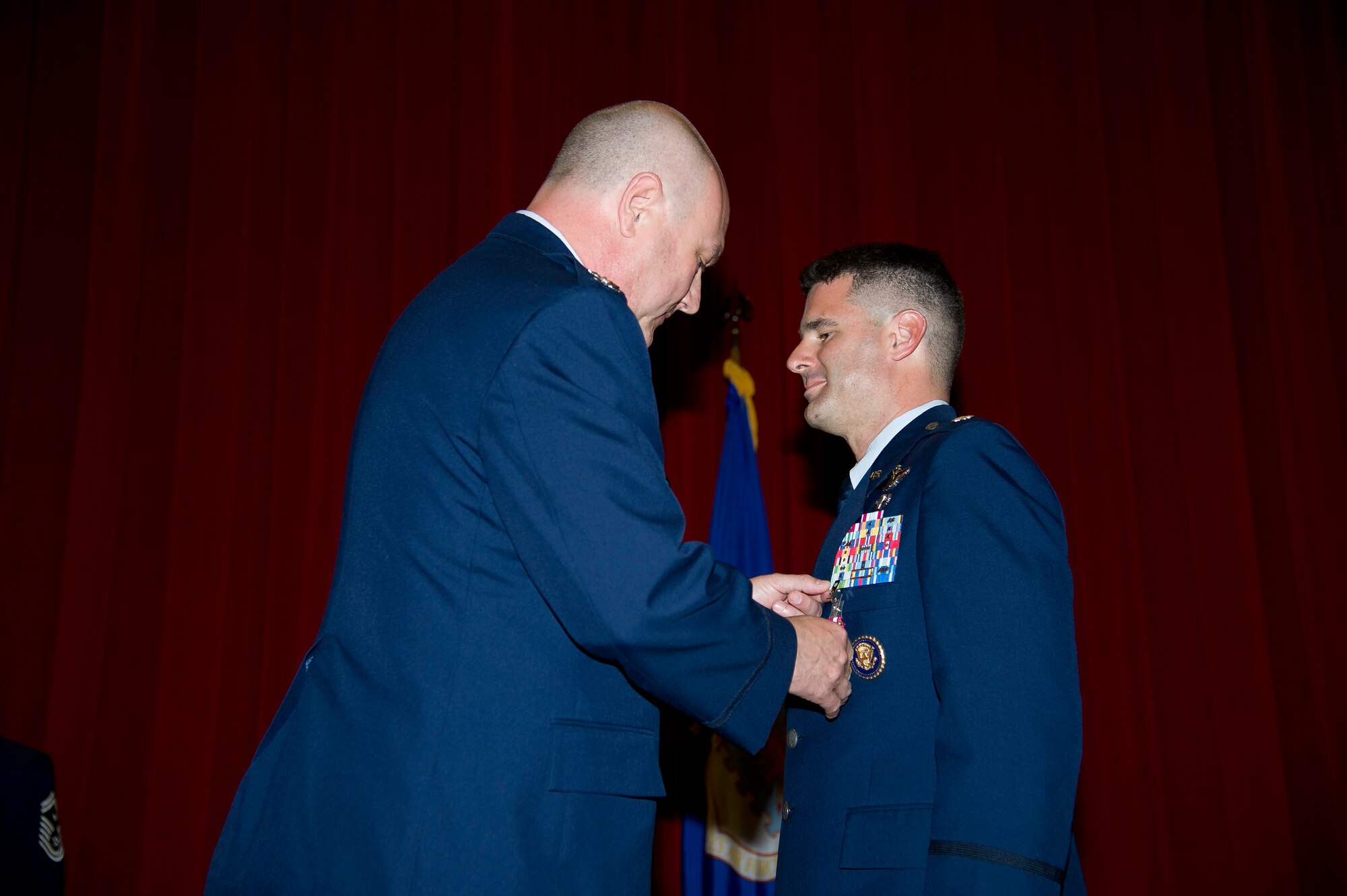 Lt. Col. Scott Minton, 912th Air Refueling Squadron incoming commander, takes command of the 912th ARS from Lt. Col. Brice Middleton, 912th ARS  outgoing commander, July 21, during a change of command ceremony in the Cultural Resource Center. Col. Shawn Teagan, 92nd Operations Group commander, Fairchild AFB, Wash., presided over the event. Senior Master Sgt. Eric Butt, 912th ARS first sergeant, holds the guidon which symbolizes the transfer of authority from the old to the new commander. (U.S. Air Force photo by Staff Sgt. Matthew Smith)