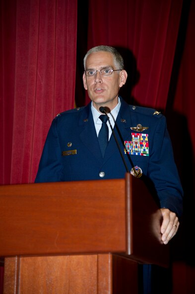 Lt. Col. Scott Minton, 912th Air Refueling Squadron incoming commander, takes command of the 912th ARS from Lt. Col. Brice Middleton, 912th ARS  outgoing commander, July 21, during a change of command ceremony in the Cultural Resource Center. Col. Shawn Teagan, 92nd Operations Group commander, Fairchild AFB, Wash., presided over the event. Senior Master Sgt. Eric Butt, 912th ARS first sergeant, holds the guidon which symbolizes the transfer of authority from the old to the new commander. (U.S. Air Force photo by Staff Sgt. Matthew Smith)
