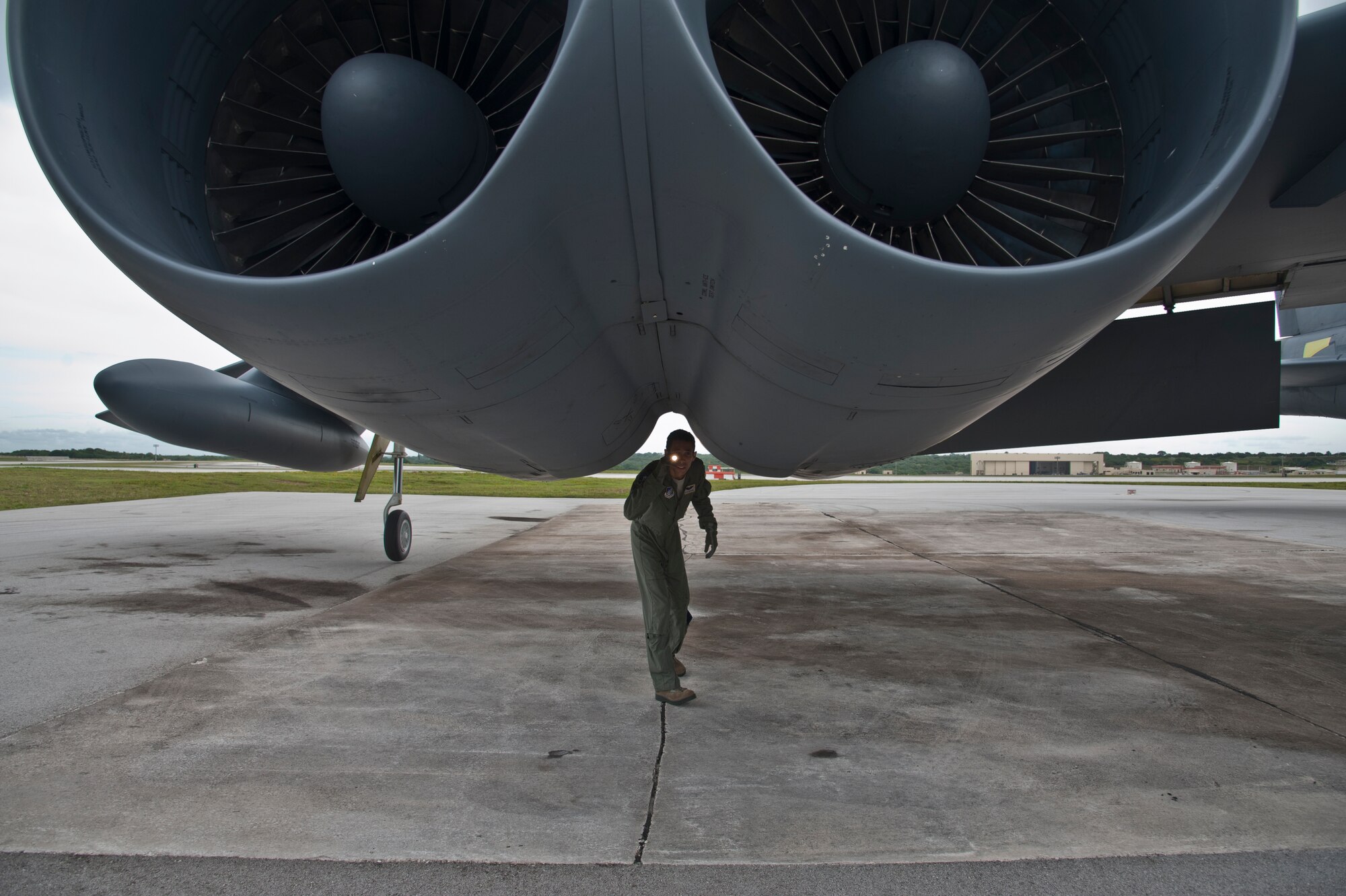 ANDERSEN AIR FORCE BASE, Guam-Members of the 69th Expeditionary Bomber Squadron, deployed in from Minot Air Force Base, North Dakota, perform pre-flight checks on a B-52 Stratofortress aircraft to participate in Exercise Pitch Black here August 2. PB 12 is a multilateral exercise conducted between the U.S. Marine Corps and Australian Defense Force, Royal Thai Armed Forces, Singapore Armed Forces, New Zealand Defense Force, Malaysian Armed Forces, French Armed Forces, British Armed Forces, Indonesian National Armed Forces and a component operating under the North Atlantic Treaty Organization in order to develop greater interoperability and a seamless response to regional crises. Greater collaboration between partner militaries strengthens regional peace, stability and prosperity.  (U.S. Air Force photo by Staff Sgt. Alexandre Montes)
