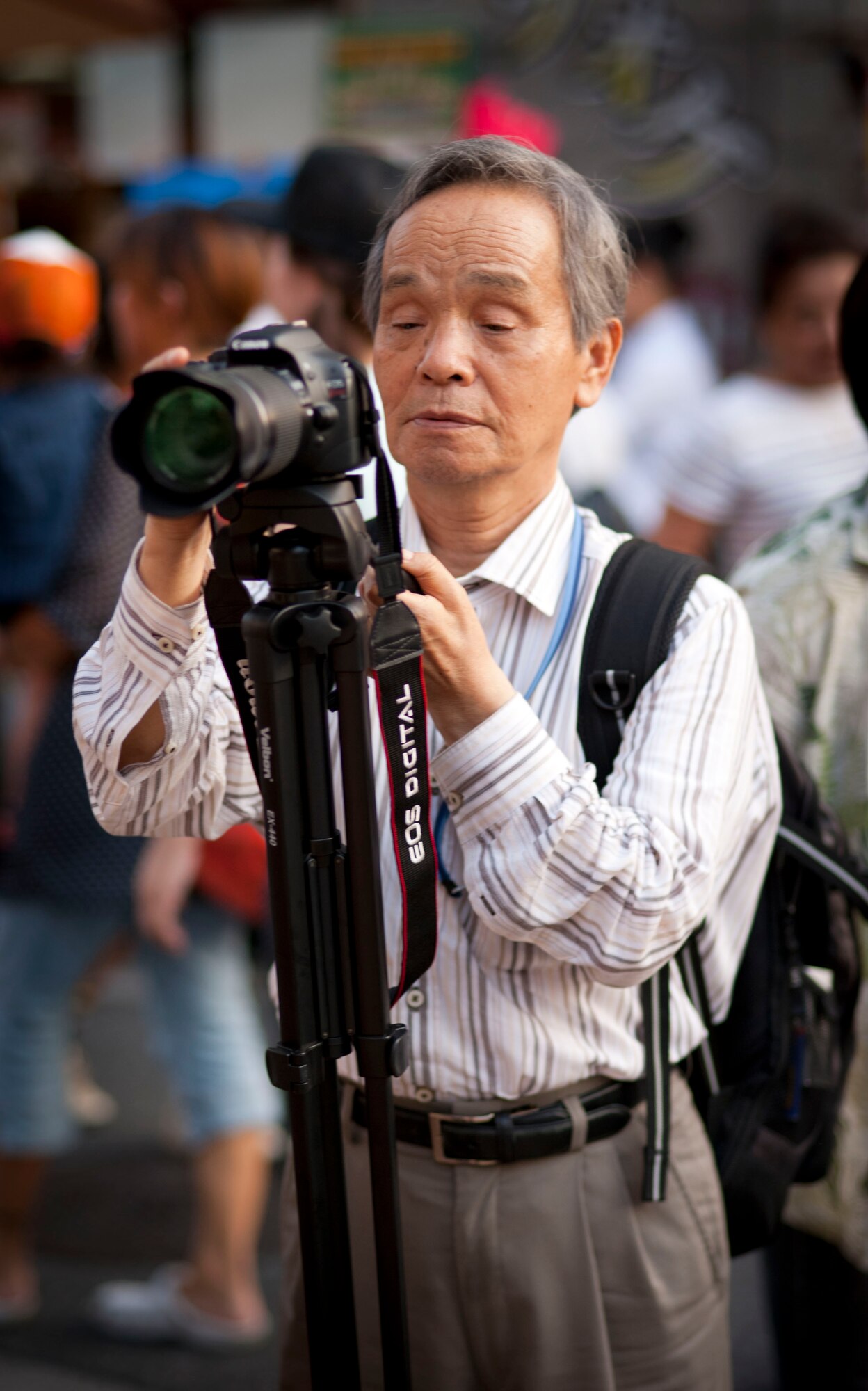 FUSSA CITY, Japan -- A Japanese man attending the 2012 Tanabata Festival, videotapes the crowd before the start of the Mikoshi Shrine Carrying Parade in Fussa City, Japan, August 3, 2012. He collects video and still photos for his YouTube page each year. (U.S. Air Force photo by Airman 1st Class Krystal M. Garrett)