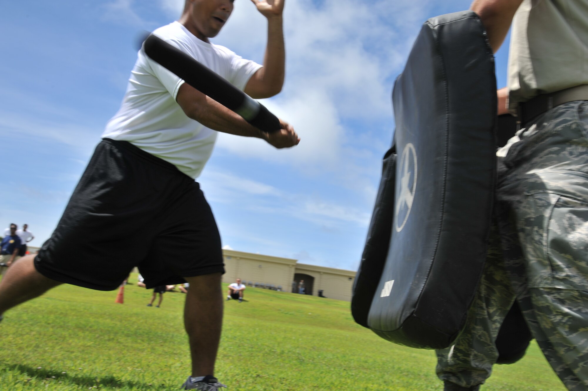 ANDERSEN AIR FORCE BASE, Guam-Department of Defense police officer cadets train with Oleoresin Capsicum Spray through a five-station obstacle course for qualification here July 27. After completing the course, the recruits will become DoD police officers for Andersen AFB and security guards for Naval Base Guam. This training is required so officers get first-hand experience using the weapon and can still perform their duties if they are sprayed during an incident. The academy is nine weeks for DoD police officer’s and five weeks for the security guards. The current class consists of 18 police officers and two security guards. Upon completion, 17 DoD police officers will be assigned to Andersen. This program was postured to enhance the security of the installation and ensure qualified personnel are manning the gates and patrols. (U.S. Air Force Photo by Staff Sgt. Alexandre Montes/RELEASED) 