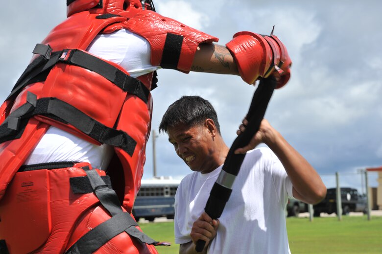 ANDERSEN AIR FORCE BASE, Guam-Department of Defense police officer cadets train with Oleoresin Capsicum Spray through a five-station obstacle course for qualification here July 27. After completing the course, the recruits will become DoD police officers for Andersen AFB and security guards for Naval Base Guam. This training is required so officers get first-hand experience using the weapon and can still perform their duties if they are sprayed during an incident. The academy is nine weeks for DoD police officer’s and five weeks for the security guards. The current class consists of 18 police officers and two security guards. Upon completion, 17 DoD police officers will be assigned to Andersen. This program was postured to enhance the security of the installation and ensure qualified personnel are manning the gates and patrols. (U.S. Air Force Photo by Staff Sgt. Alexandre Montes/RELEASED) 