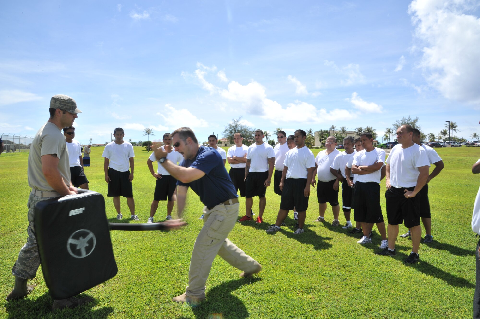 ANDERSEN AIR FORCE BASE, Guam-Department of Defense police officer cadets train with Oleoresin Capsicum Spray through a five-station obstacle course for qualification here July 27. After completing the course, the recruits will become DoD police officers for Andersen AFB and security guards for Naval Base Guam. This training is required so officers get first-hand experience using the weapon and can still perform their duties if they are sprayed during an incident. The academy is nine weeks for DoD police officer’s and five weeks for the security guards. The current class consists of 18 police officers and two security guards. Upon completion, 17 DoD police officers will be assigned to Andersen. This program was postured to enhance the security of the installation and ensure qualified personnel are manning the gates and patrols. (U.S. Air Force Photo by Staff Sgt. Alexandre Montes/RELEASED) 