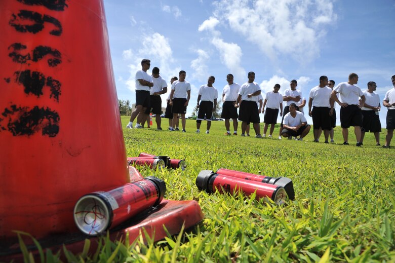 ANDERSEN AIR FORCE BASE, Guam-Department of Defense police officer cadets train with Oleoresin Capsicum Spray through a five-station obstacle course for qualification here July 27. After completing the course, the recruits will become DoD police officers for Andersen AFB and security guards for Naval Base Guam. This training is required so officers get first-hand experience using the weapon and can still perform their duties if they are sprayed during an incident. The academy is nine weeks for DoD police officer’s and five weeks for the security guards. The current class consists of 18 police officers and two security guards. Upon completion, 17 DoD police officers will be assigned to Andersen. This program was postured to enhance the security of the installation and ensure qualified personnel are manning the gates and patrols. (U.S. Air Force Photo by Staff Sgt. Alexandre Montes/RELEASED) 