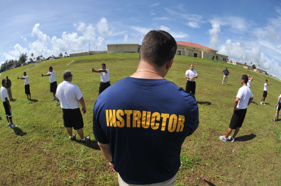 ANDERSEN AIR FORCE BASE, Guam-Department of Defense police officer cadets train with Oleoresin Capsicum Spray through a five-station obstacle course for qualification here July 27. After completing the course, the recruits will become DoD police officers for Andersen AFB and security guards for Naval Base Guam. This training is required so officers get first-hand experience using the weapon and can still perform their duties if they are sprayed during an incident. The academy is nine weeks for DoD police officer’s and five weeks for the security guards. The current class consists of 18 police officers and two security guards. Upon completion, 17 DoD police officers will be assigned to Andersen. This program was postured to enhance the security of the installation and ensure qualified personnel are manning the gates and patrols. (U.S. Air Force Photo by Staff Sgt. Alexandre Montes/RELEASED) 
