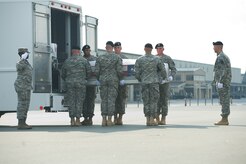 A U.S. Army carry team transfers the remains of Army Pfc. Jesus J. Lopez of San Bernardino, Calif., at Dover Air Force Base, Del., Aug. 4, 2012. Lopez was assigned to the 1st Battalion, 28th Infantry Regiment, 4th Infantry Brigade Combat Team, 1st Infantry Division, Fort Riley, Kan. (U.S. Air Force photo/Adrian R. Rowan)