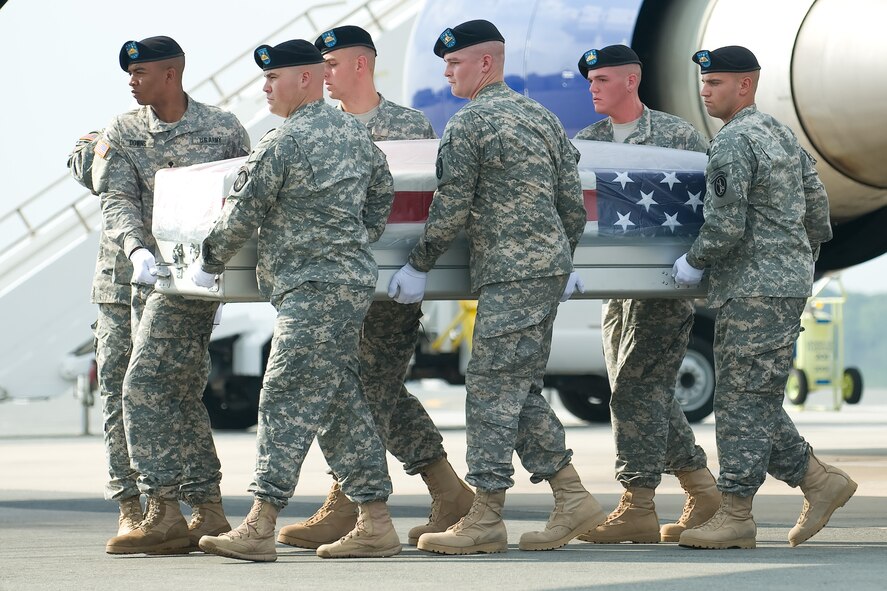 A U.S. Army carry team transfers the remains of Army 1st Sgt. Russell R. Bell of Tyler, Texas, at Dover Air Force Base, Del., Aug. 4, 2012. Bell was assigned to the 1st Battalion, 508th Parachute Infantry Regiment, 4th Brigade Combat Team, 82nd Airborne Division, Fort Bragg, N.C. (U.S. Air Force photo/Adrian R. Rowan)