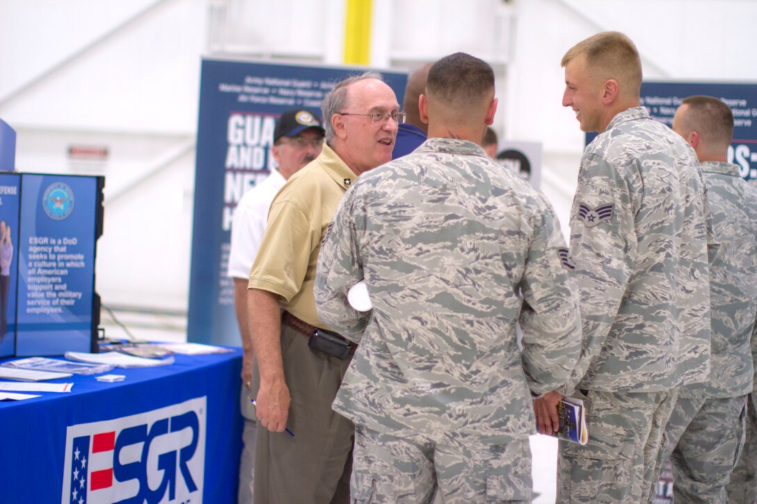 YOUNGSTOWN AIR RESERVE STATION, Ohio -- U.S. Air Force Reserve Senior Airman Corey Snyder, a firefighter with the 910th Civil Engineer Squadron here, talks with a representative from Employer Support of the Guard and Reserve (ESGR) during the 2012 Job and Education Fair Aug. 4, 2012 in Hangar 302 here. Approximately 300 Youngstown Air Reserve Station Reservists and their dependents attended the three-hour event that featured more than 40 educators and potential employers. U.S. Air Force photo by Tech. Sgt. Brenda Haines