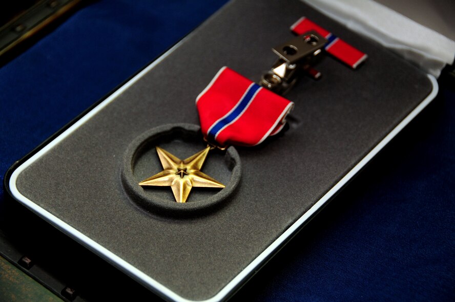 The Bronze Star was presented to Senior Master Sgt. Doug Margelony, assigned to the 103rd Civil Engineer Squadron, Bradley Air National Guard Base, East Granby, Conn., May 5, 2012. The Bronze Star is a United States Armed Forces individual military decoration that may be awarded for bravery, acts of merit, or meritorious service. (U.S. Air Force photo by Tech. Sgt. Tedd Andrews/Released)