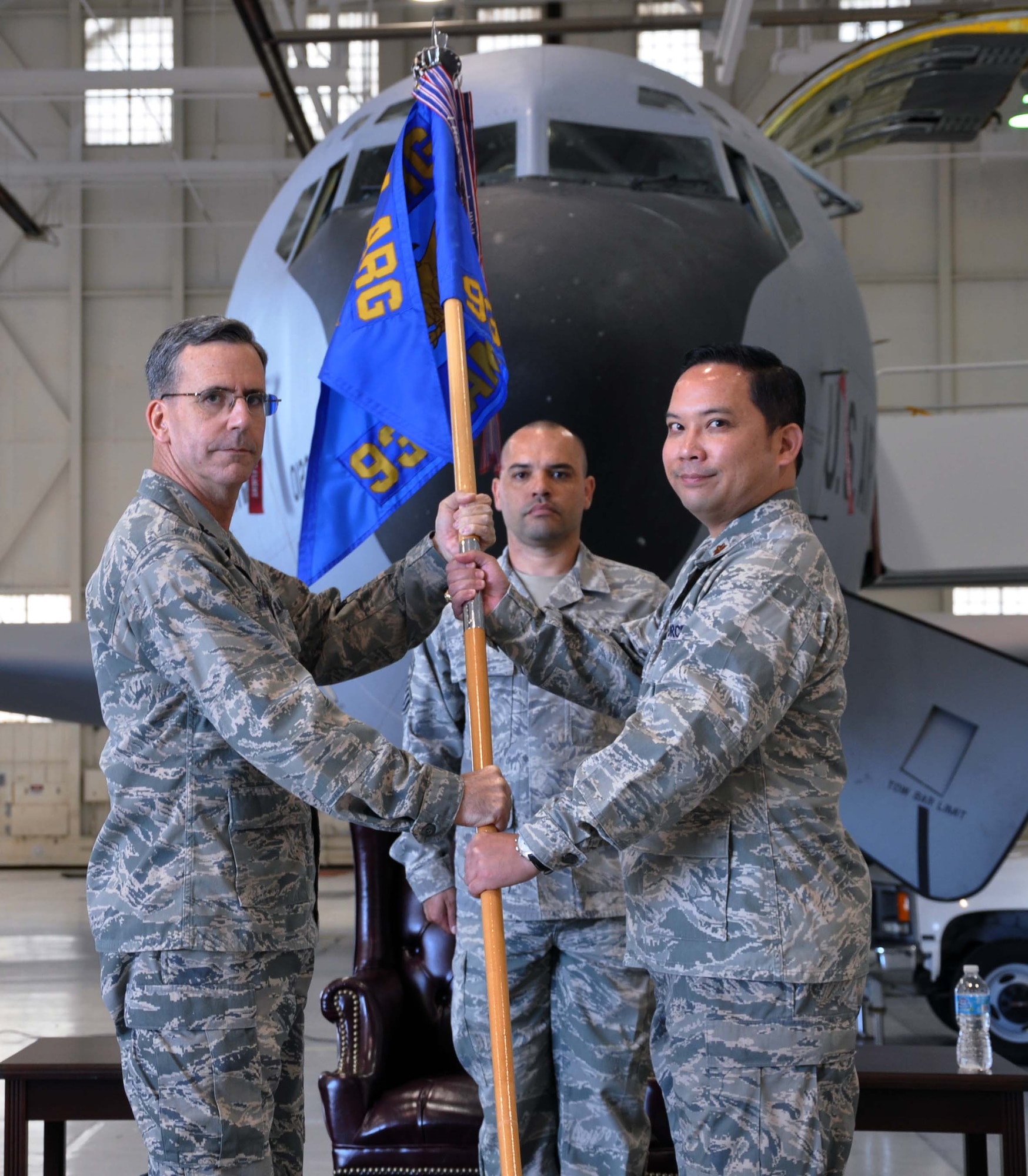 Col. Donald C. Robison, deputy commander for maintenance, 931st Air Refueling Group, presents the 931st Aircraft Maintenance Squadron guidon to Maj. Vincent E. Casquejo during a change of command ceremony at McConnell Air Force Base, Kan., Aug. 5, 2012.  Casquejo assumed command of the 931 AMXS, replacing outgoing commander, Maj. Robert T. Thompson.  (U.S. Air Force photo by 1st Lt. Zach Anderson)