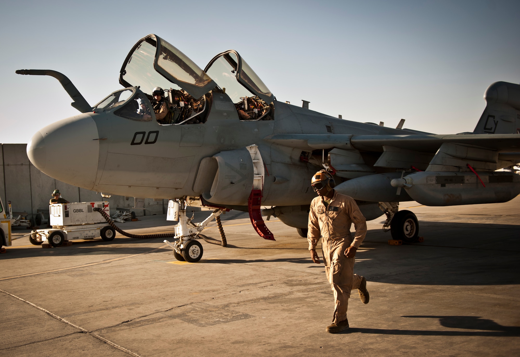 Marines assigned to Marine Tactical Electronic Warfare Squadron-2 prepare an EA-6B Prowler for a mission at Bagram Airfield, Afghanistan, 2 August, 2012. The Prowler is a long-range, all-weather aircraft with advanced electronic countermeasures capability. (U.S. Air Force Photo/Capt. Raymond Geoffroy)