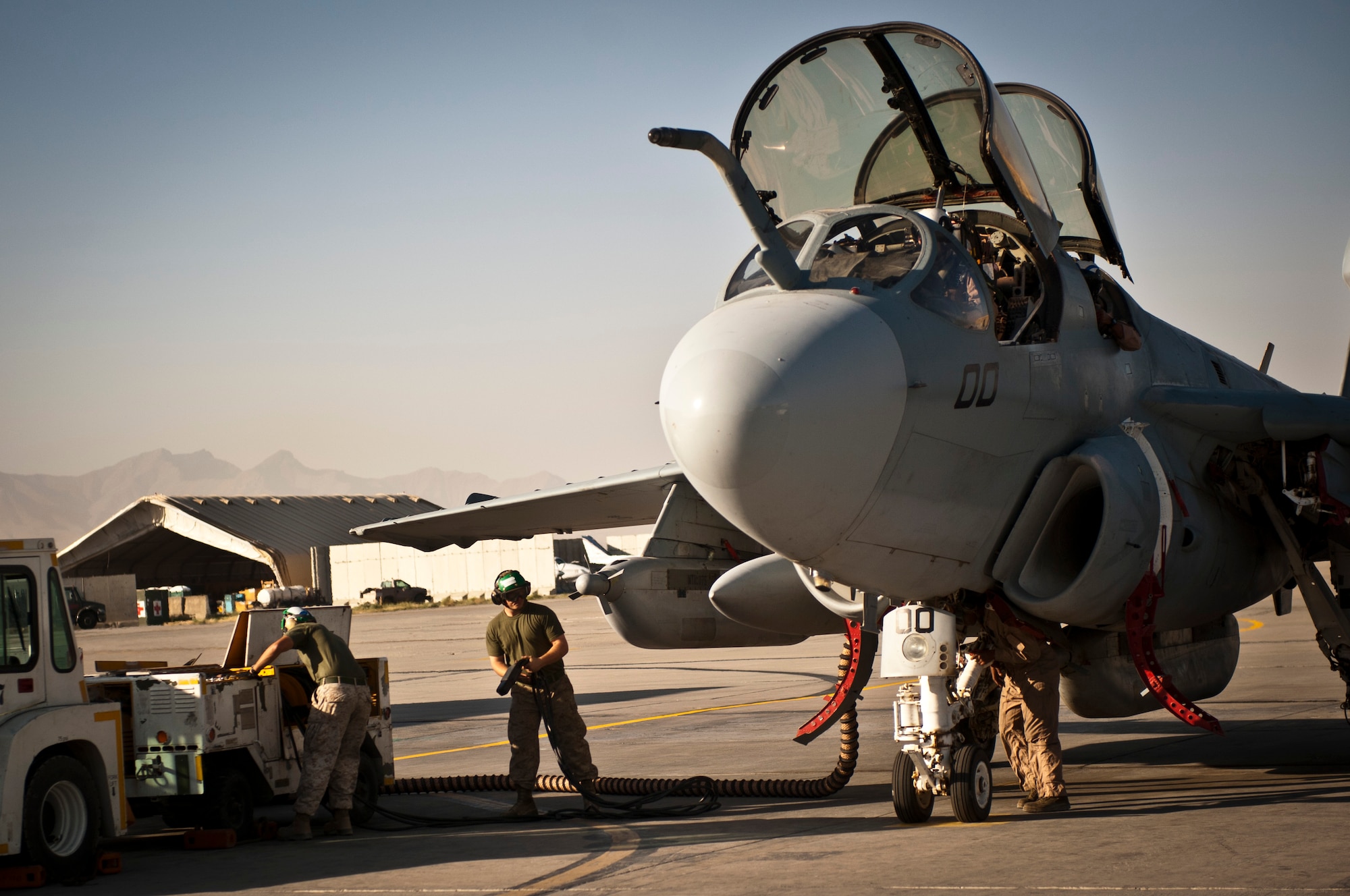 Marines assigned to Marine Tactical Electronic Warfare Squadron-2 prepare an EA-6B Prowler for a mission at Bagram Airfield, Afghanistan, 2 August, 2012. The Prowler is a long-range, all-weather aircraft with advanced electronic countermeasures capability. (U.S. Air Force Photo/Capt. Raymond Geoffroy)