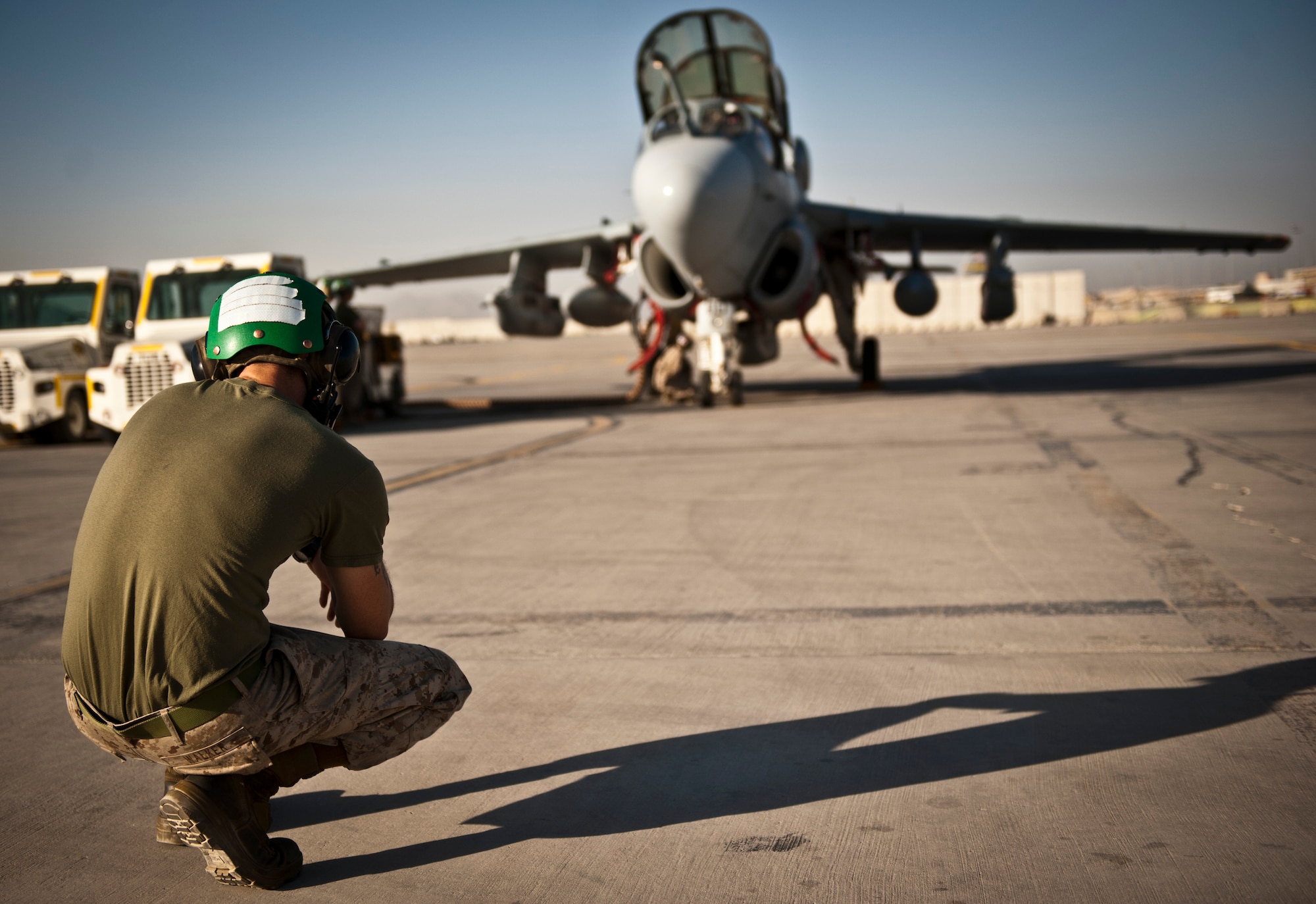 Sergeant Andrew Walker U.S. Marine Corps aircraft maintainer assigned to Marine Tactical Electronic Warfare Squadron-2 stands-by during pre-flight checks at Bagram Airfield, Afghanistan, 2 August, 2012. In a fight where the enemy is updating their unconventional tactics, having a dedicated electronic warfare platform keeping watch over coalition forces can prove vital and the Marines of VMAQ-2 are well equipped to meet this mission. (U.S. Air Force Photo/Capt. Raymond Geoffroy)