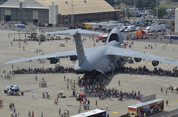 Crowds at the Great New England Air Show gather under the wings of the enormous C-5 to find shade and also tour the aircraft at Westover Air Reserve Base on August 4, 2012. The Air Show this weekend is the largest Westover has had since 1974, boasting more than 60 aircraft. (U.S. Air Force photo/TSgt. Timm Huffman)