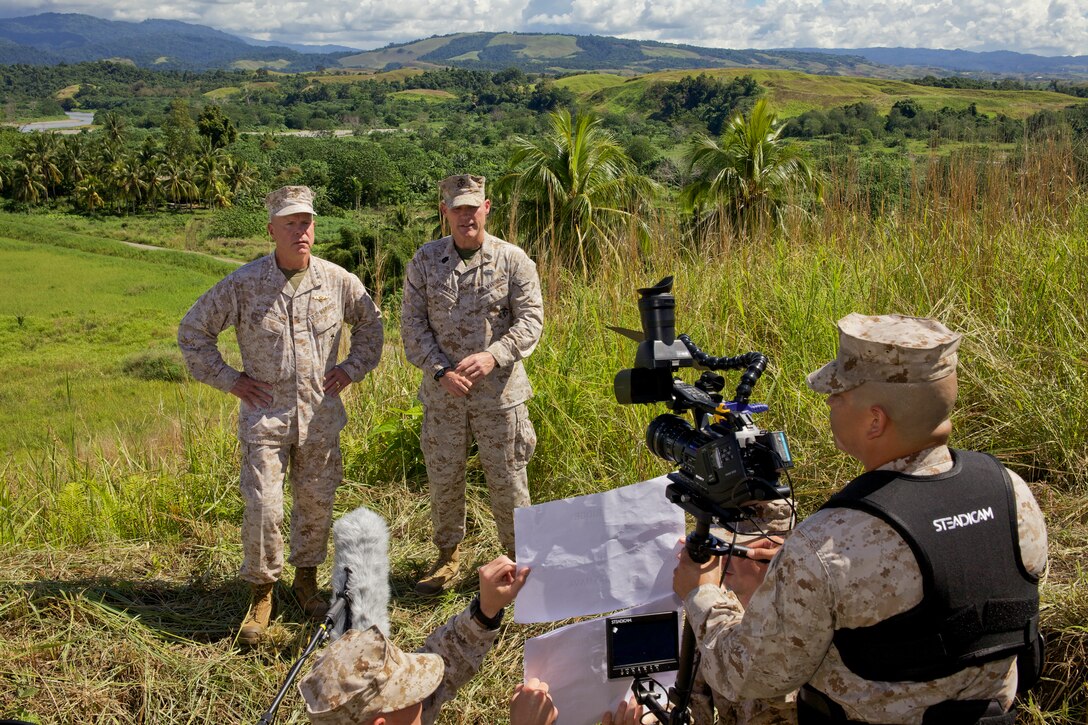 Gen. James F. Amos, the 35th Commandant of the Marine Corps, and Sgt. Maj. Micheal P. Barrett, the 17th Sergeant Major of the Marine Corps, film part of the 2012 Marine Corps Birthday Video during a visit to Guadalcanal, Solomon Islands, Aug. 6, 2012.