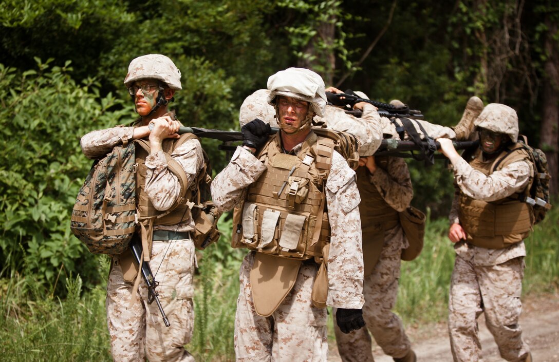 Marines with Corporal’s Course Class 6-12 carry a simulated casualty during the final exercise of Corporal's Course at The Staff Non-Commissioned Officer’s Academy on Camp Johnson, N.C., June 25. The course is the first in a series of professional military education classes at the academy that provides Marines with leadership training to enhance their professional qualifications as they take on greater responsibility.