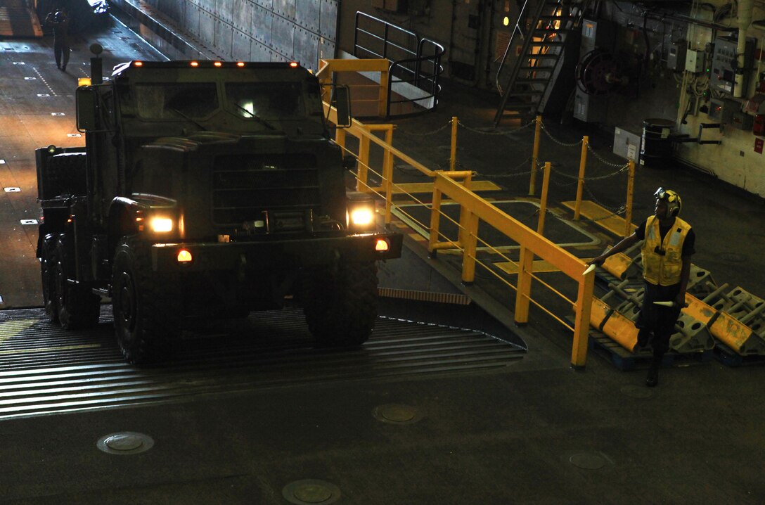 A Medium Tactical Vehicle Replacement climbs the ramps aboard the USS San Antonio and joins nearly 100 Marines from Combat Logistics Regiment 27, 2nd Marine Logistics Group on their way to Maine’s 2012 Lobster Festival in Rockland, July 30, 2012. The vehicles and personnel aboard the San Antonio will provide the public with a unique, one-on-one opportunity to interact with the servicemembers and their equipment. (Photo by Lance Cpl. Paul Peterson)