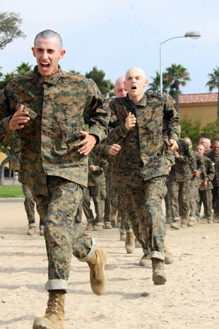 Recruits, Company H, 2nd Recruit Training Battalion, run after their drill instructors as they begin the Combat Conditioning Exercise Aug. 1 aboard Marine Corps Recruit Depot San Diego. The purpose of the exercise is to have the recruits execute close combat techniques while under stress. Through this, recruits will build confidence knowing that they'll be able to perform.