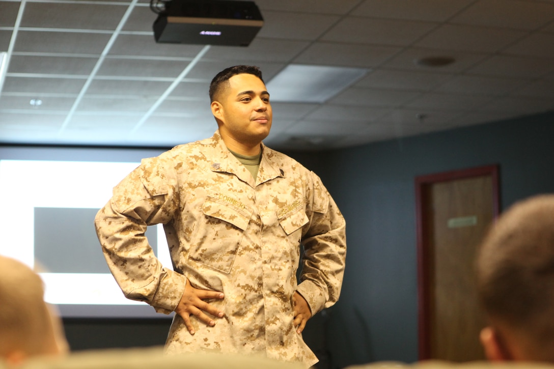 Sgt. Darwin Cornejo listens to a student while teaching Never Leave a Marine Behind aboard Marine Corps Base Camp Lejeune Aug. 2. Cornejo thought several classes to junior Marines and noncommissioned officers from Headquarters and Support Battalion.