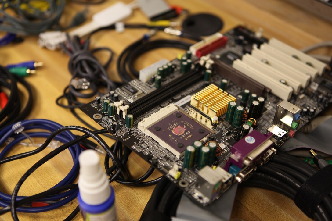 Various computer parts and equipment lay across a table at room 219 of the John A. Lejeune Education Center aboard Marine Corps Base Camp Lejeune. Room 219 is home to the Wounded Warrior Project's Transition Training School's free information technology classes.   