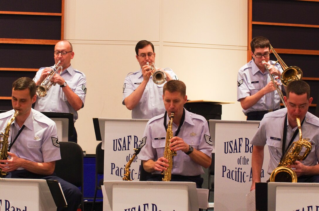 YOKOTA AIR BASE, Japan -- Pacific Showcase jazz ensemble members read and perform a piece of music for the first time as a new musical group at the Band of the Pacific-Asia, Yokota Air Base, Japan, Aug. 6, 2012.  The ability to perform a new piece of music at a professional level the first time is a skill required for members of Air Force bands. (U.S. Air Force photo/Senior Airman Brian Lumpkin)