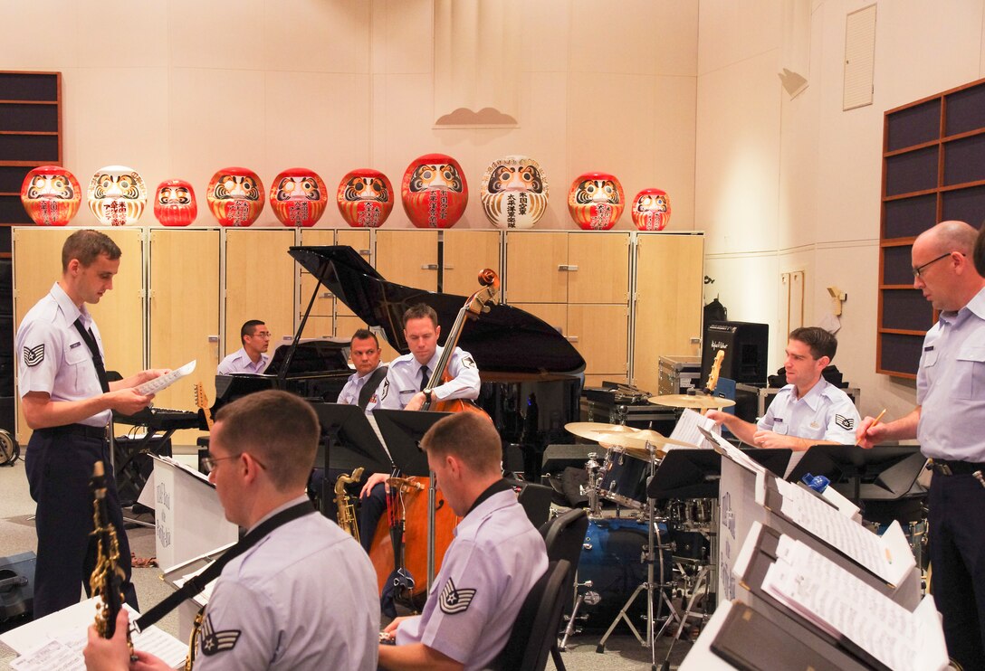 YOKOTA AIR BASE, Japan -- Tech. Sgt. Ricky Sweum, Band of the Pacific-Asia saxophonist, left, gives opening remarks during the first rehearsal of a newly revived Pacific Showcase at the Band of the Pacific-Asia, Yokota Air Base, Japan, Aug. 6, 2012.  This is the first time in many years that the Band of the Pacific-Asia has had a big band in the squadron.  (U.S. Air Force photo/Senior Airman Brian Lumpkin)