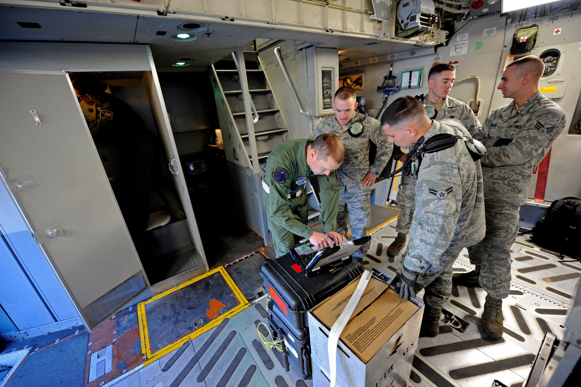 Airmen from the 703rd Aircraft Maintenance Squadron prepare a C-17 Globemaster III for a flight to Hill Air Force Base, Utah, Aug. 3, 2012. The combined Alaska ANG and JBER active-duty aircrew provided a team of JBER reservists airlift to Hill so they could participate in the upcoming Combat Hammer exercise. (U.S. Air Force photo/Tech. Sgt. Brian Ferguson)