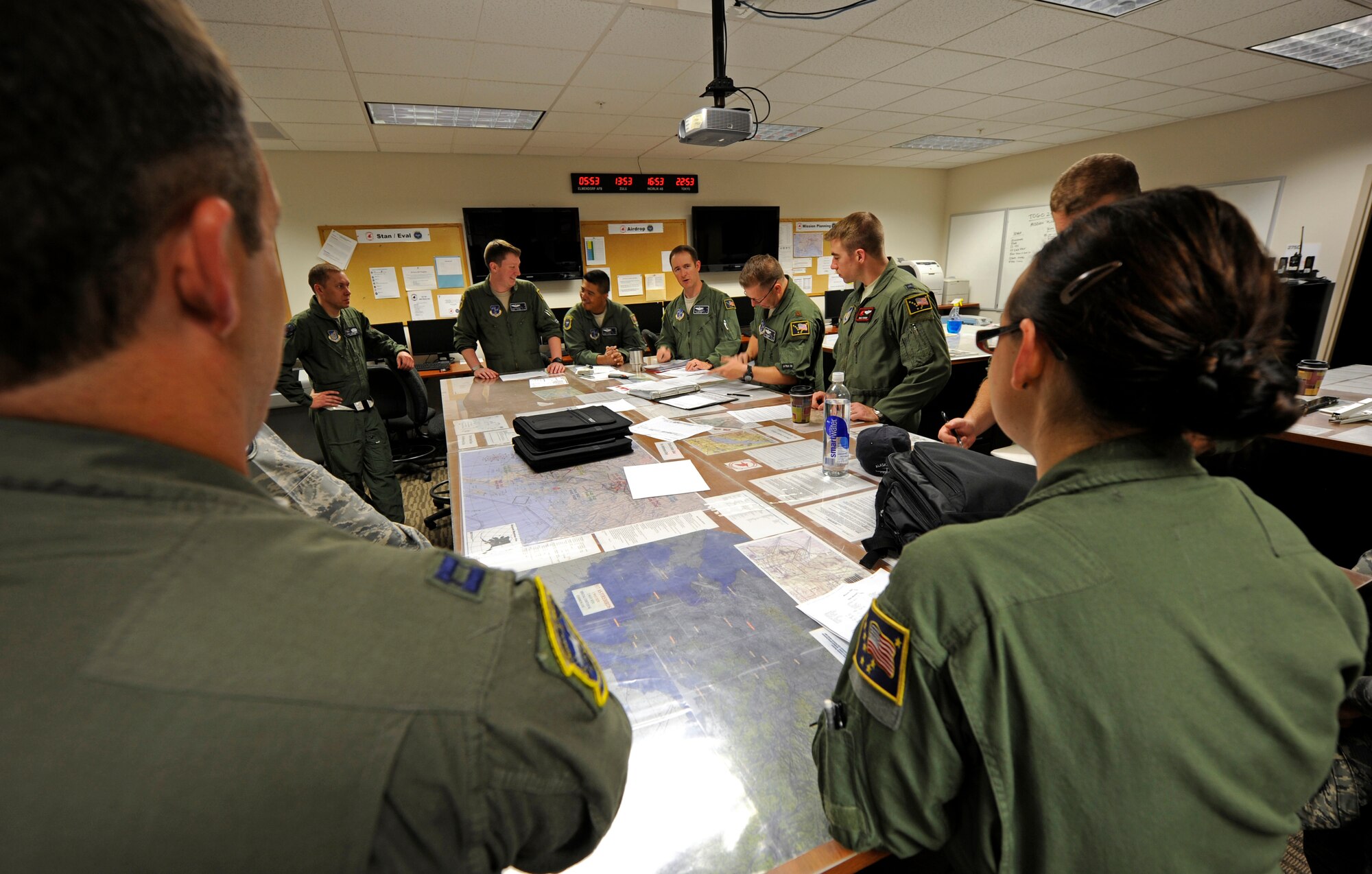 Alaska Air National Guard members from the 249th Airlift Squadron and active duty members from the 517th AS take part in a flight brief at the 517th AS, Aug. 3, 2012, prior to a flight to Hill Air Force Base, Utah. The combined Alaska ANG and JBER active-duty aircrew provided a team of JBER reservists airlift to Hill so they could participate in the upcoming Combat Hammer exercise. (U.S. Air Force photo/Tech. Sgt. Brian Ferguson)