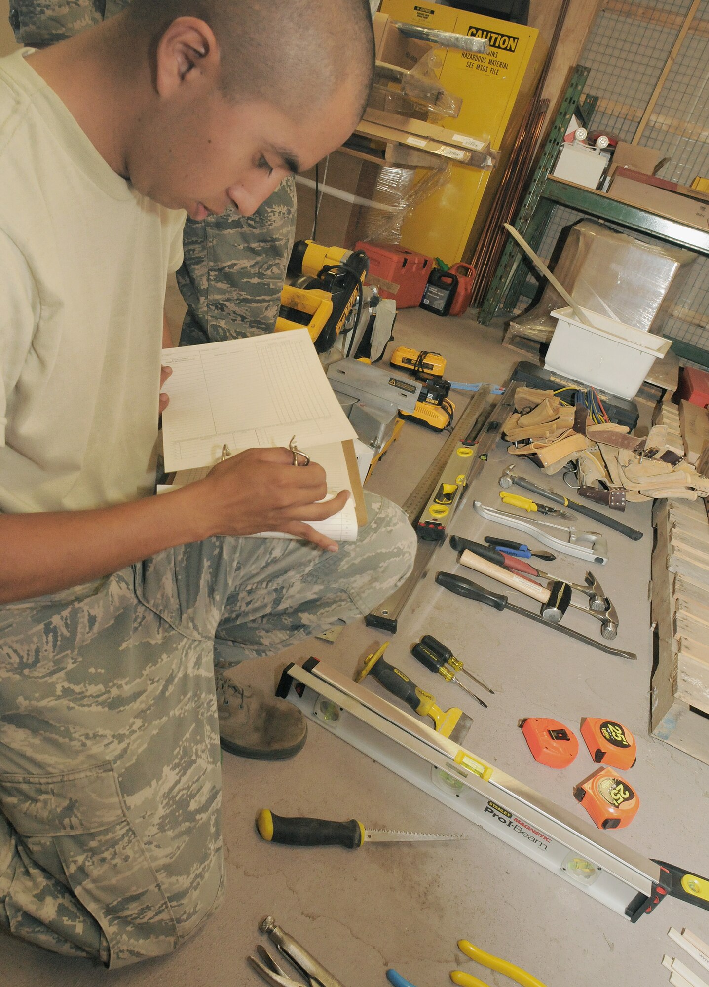 Senior Airman Mario Lopez Casas takes inventory of tools while performing annual training in Cold Lake, Alberta, Canada. The 146th Airlift Wing Civil Engineering Squadron, Channel Islands Air National Guard Station, Port Hueneme, Calif. performed their annual training at Canadian Forces Base, Cold Lake, Alberta, Canada July 28-Aug. 11, 2012, taking on several ventures, including a renovation at a children’s day care center and a grading project for a concrete storage compound to support sea containers. (U.S. Air Force photo by Tech. Sgt. Alex Koenig)