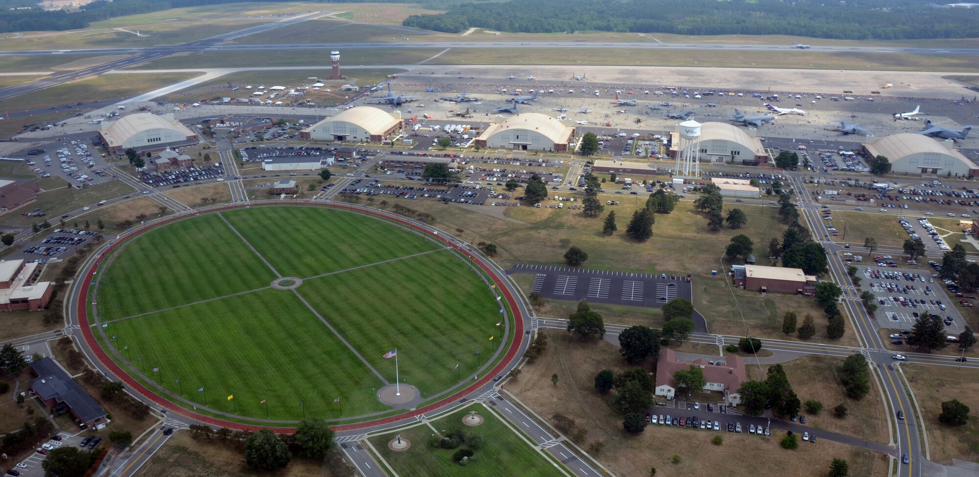 Westover Air Reserve Base as seen from a Massachusetts State Police helicopter during this years Great New England Air Show and open house in August 2012. The base ellipse looks like a compass from above with the Base Hangar at the east end and the flag at the west end. (U.S. Air Force photo/SrA. Kelly Galloway)