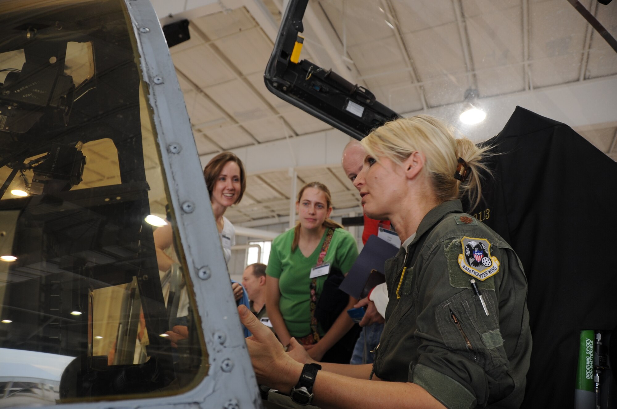 A-10 Thunderbolt II pilot Maj. Audrey Orek, 303rd Fighter Squadron, answers questions about the A-10 to civilian employers of 442nd Fighter Wing reservists during Employer Day, Aug. 4, 2012 here. Employer Day allows the civilian employers of Air Force reservists the opportunity to see what their employees do on their Reserve weekend as well as thank the employees for their flexibility and support. The 303 FS is assigned to the 442 FW, an Air Force Reserve unit stationed at Whiteman Air Force Base Mo. (U.S. Air Force photo/Staff Sgt. Lauren Padden)