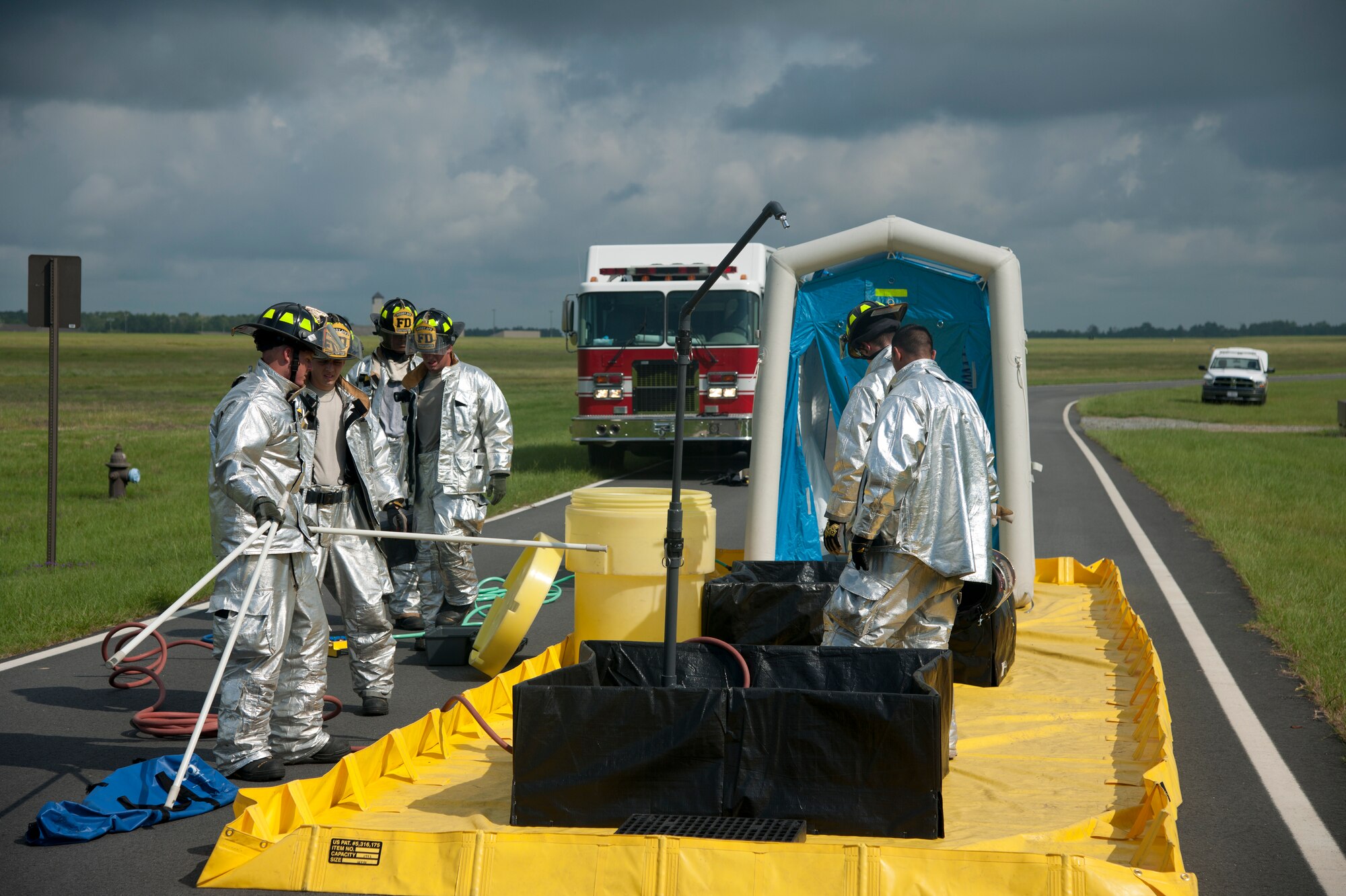 The 23d Civil Engineer Squadron firefighters set up a decontamination center during a weapons exercise at Moody Air Force Base, Ga., Aug. 3, 2012.  The exercise had 4 stages: initial response, evacuation, search and secure, and chemical inspection. (U.S. Air Force photo by Airman 1st Class Paul Francis/Released)
