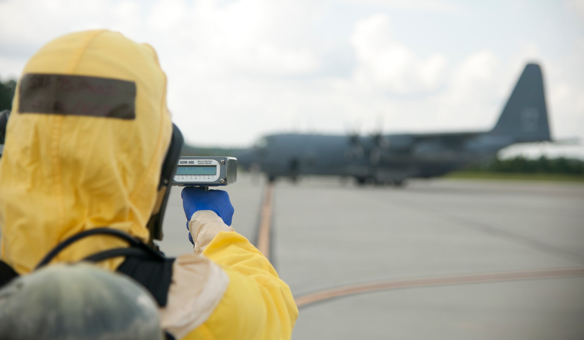 U.S. Air Force Senior Airman Rocky Bullard, 23d Civil Engineer Squadron explosive ordnance disposal journeyman, scans for chemicals during a weapons exercise at Moody Air Force Base, Ga., Aug. 3, 2012. Bullard collected the readings for reporting to the emergency operations center to advance to the next stage in the exercise. (U.S. Air Force photo by Airman 1st Class Paul Francis/Released)
