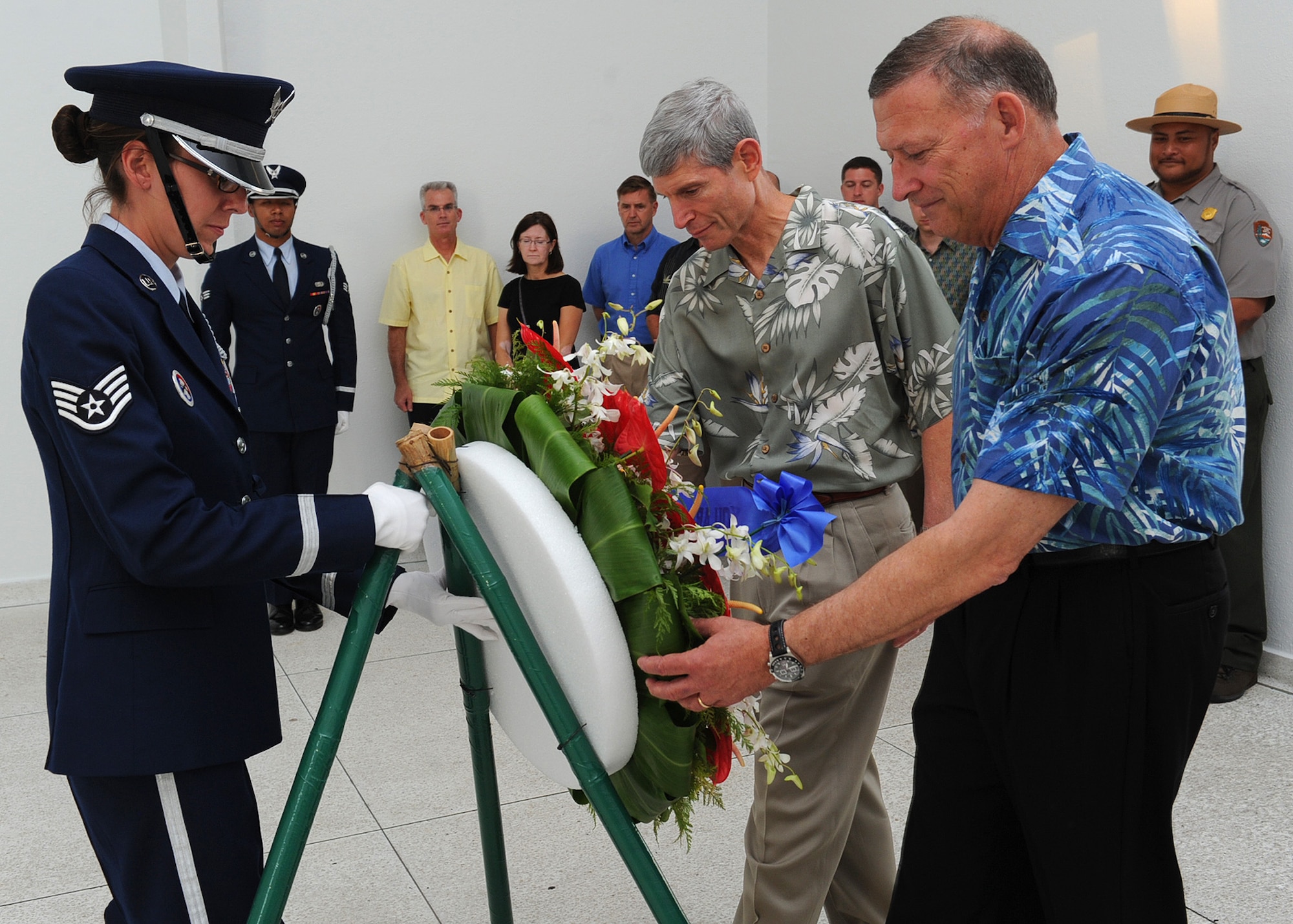 Staff Sgt. Jacquelyn Gausemel, Joint Base Pearl Harbor-Hickam honor guard member, Air Force Chief of Staff Gen. Norton Schwartz and Gen. Gary North, Pacific Air Forces commander, place a wreath at the U.S.S. Arizona memorial near JBPH-H, Hawaii, Aug. 1, 2012. (U.S. Air Force photo/Tech. Sgt. Jerome S. Tayborn)