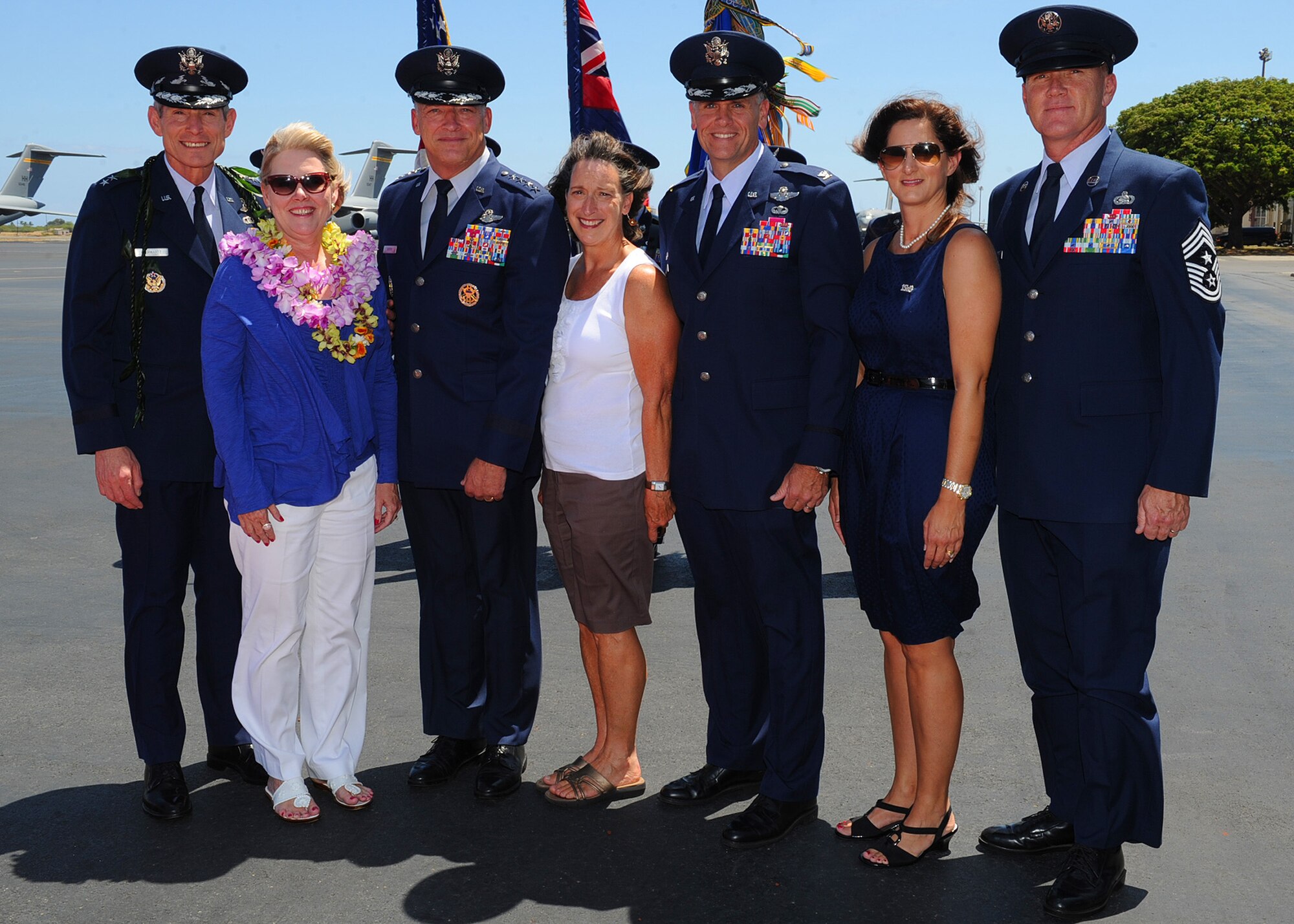 From left, Gen. Norton Schwartz, Air Force Chief of Staff, and his wife Suzie; Gen. Gary North, Pacific Air Forces commander, and his wife Shelley; Col. John Roscoe, 15th Wing commander, and his wife Jennifer; and Chief Master Sgt. Brooke McLean, PACAF command chief, pose for a group photo in front of Joint Base Pearl Harbor-Hickam Base Operations, JBPH-H, Hawaii, Aug. 1, 2012.  Schwartz visited the base to officiate the PACAF change of command ceremony. (U.S. Air Force photo/Tech. Sgt. Jerome S. Tayborn)