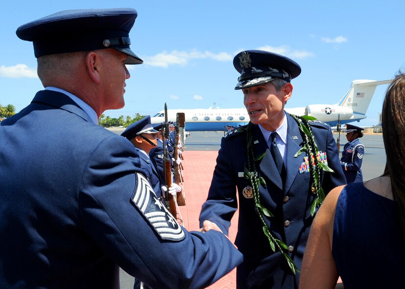 Chief Master Sgt. Brooke McLean, Pacific Air Forces command chief master sergeant, greets Air Force Chief of Staff Gen. Norton Schwartz shortly after the Schwartz’s arrival at Joint Base Pearl Harbor-Hickam, Hawaii, Aug. 1, 2012.  Schwartz visited JBPH-H to officiate the PACAF change of command ceremony. (U.S. Air Force photo/Tech. Sgt. Jerome S. Tayborn)