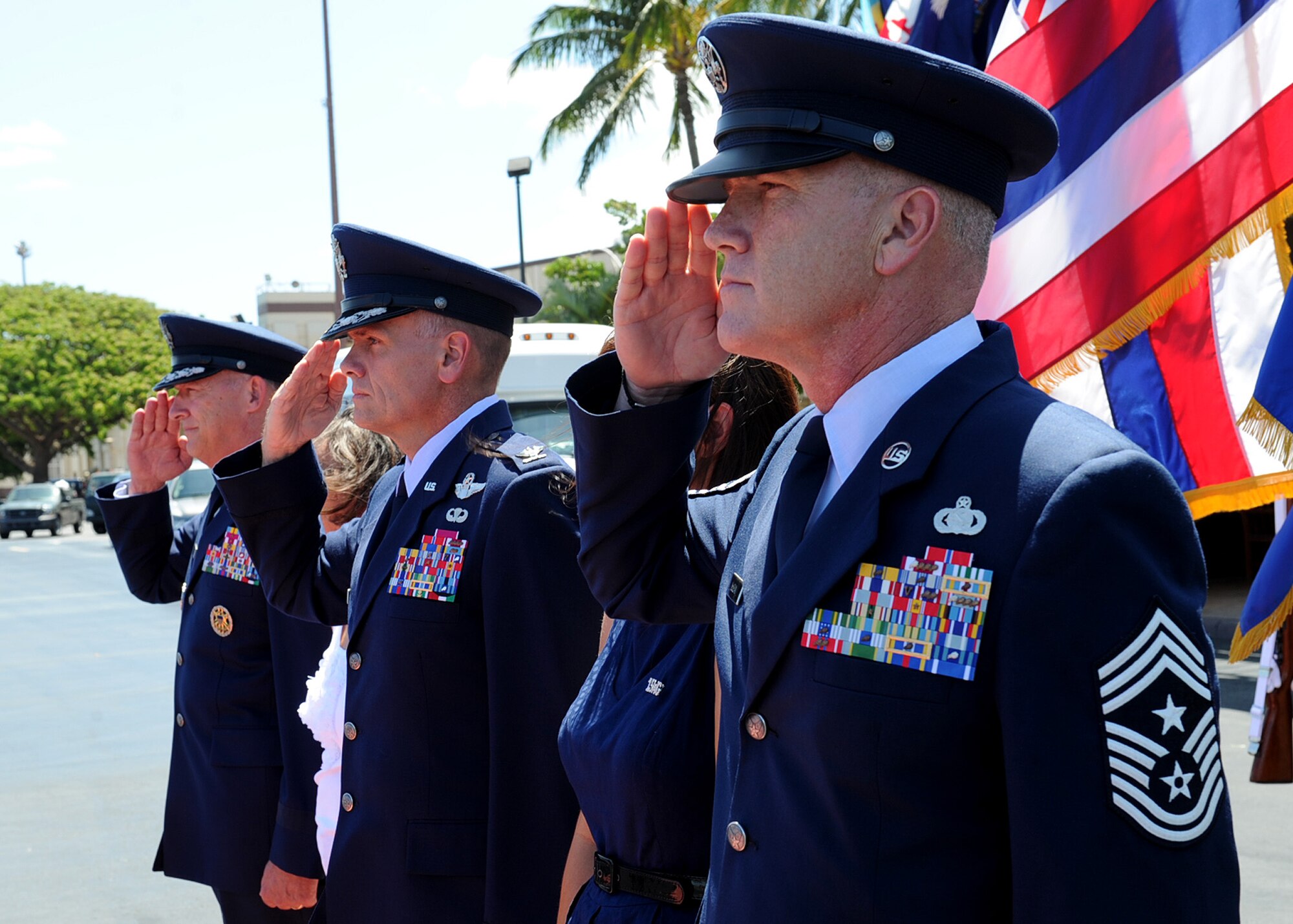 From left, Gen. Gary North, U.S. Pacific Air Forces commander, Col. John Roscoe, 15th Wing commander, and Chief Master Sgt. Brooke McLean, PACAF command chief master sergeant, salute Air Force Chief of Staff Gen. Norton Schwartz as he arrives at Joint Base Pearl Harbor-Hickam, Hawaii, Aug. 1, 2012.  Schwartz visited JBPH-H to officiate the PACAF change of command ceremony. (U.S. Air Force photo/Tech. Sgt. Jerome S. Tayborn)