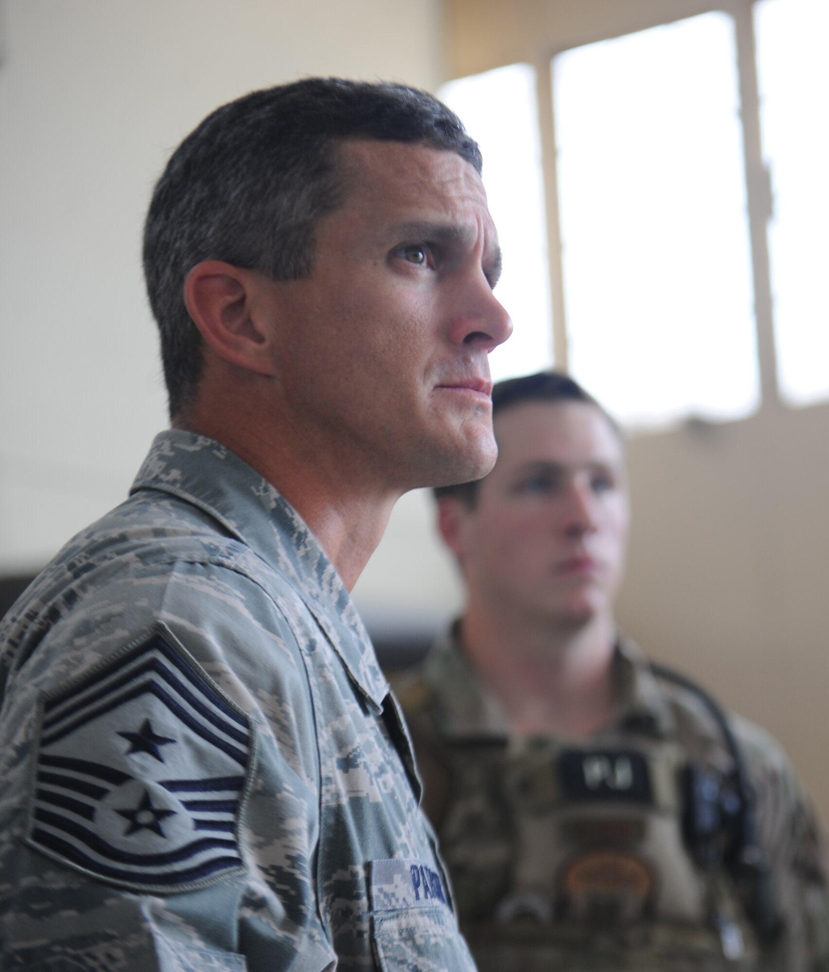 U.S. Air Force Chief Master Sgt. Rick Parsons, command chief of Air Combat Command, listens as 38th Rescue Squadron pararescuemen explain their capabilities Aug. 1, 2012, at Moody Air Force Base, Ga. Parsons met with Airmen from various units to thank them for their service and to acknowledge the many feats they accomplish every day at Moody and downrange. (U.S. Air Force photo by Staff Sgt. Jamal D. Sutter/Released)
