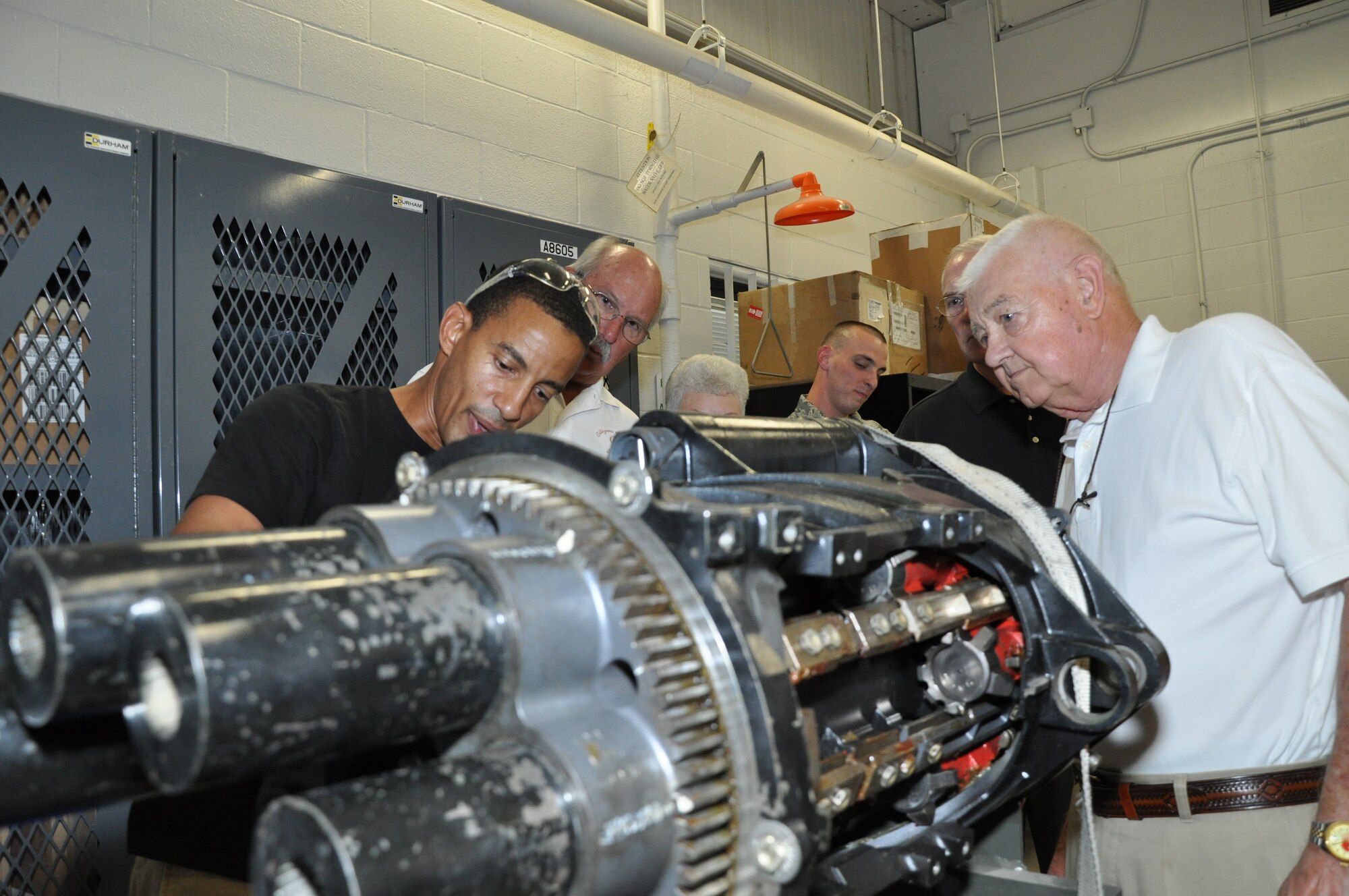 Sigmund Gross talks to Whiteman Base Community Council members from Concordia and Cole Camp, Mo., during a tour the 442nd Fighter Wing and A-10 Thunderbolt II, Aug. 2, 2012. The 442nd Fighter Wing is an A-10 Thunderbolt II Air Force Reserve unit at Whiteman Air Force Base, Mo. The Base Community Council is a group of volunteer members from nearby communities dedicated to supporting Airmen. (U.S. Air Force photo/Tech. Sgt. Kent Kagarise)