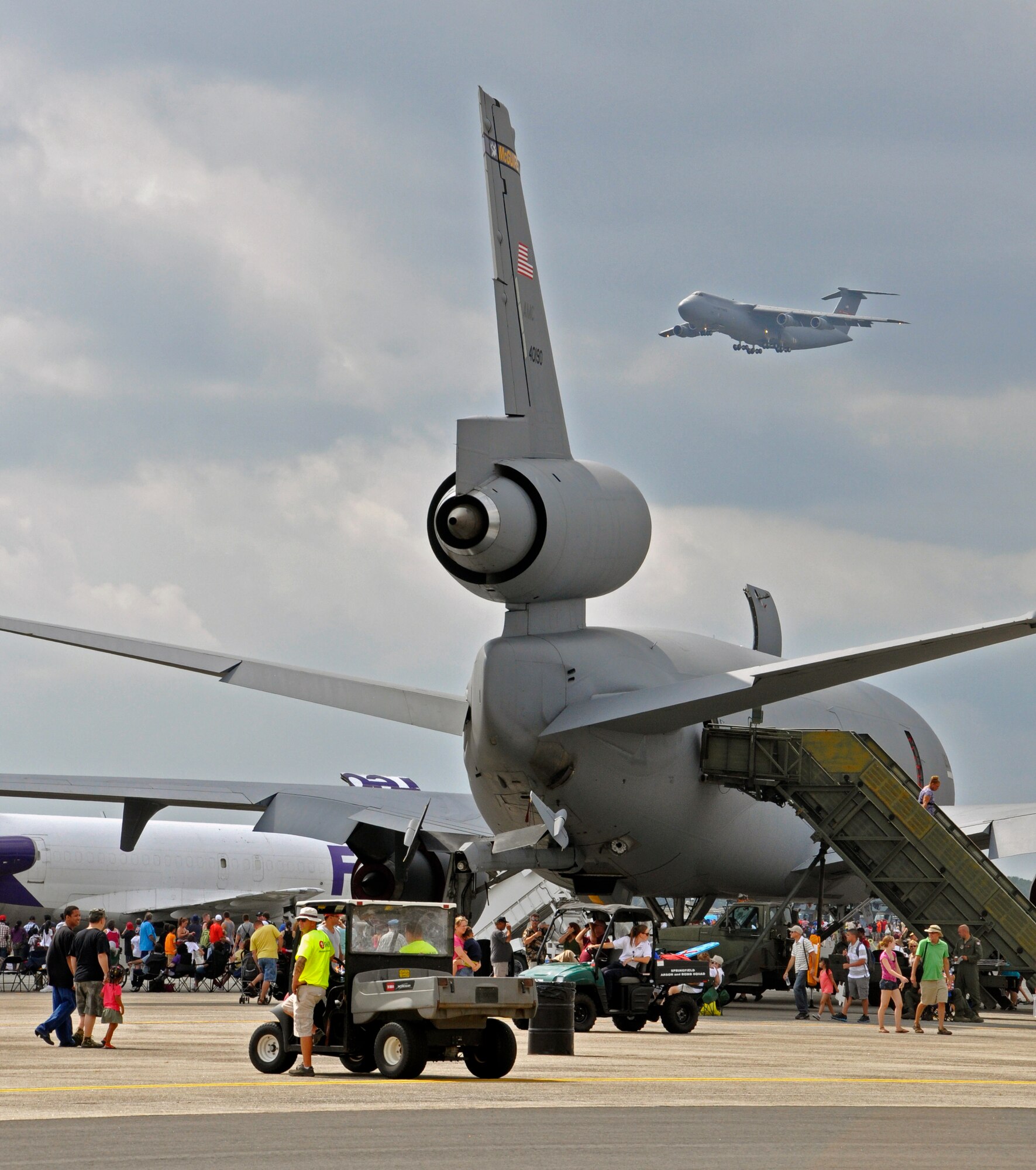 A Westover C-5 lumbers in the sky as it passes over the crowd and frames itself near the KC-10 Extender. The Air Show this year is the largest Westover has had since 1974, boasting more than 60 aircraft. (U.S. Air Force photo/MSgt. Andrew Biscoe)