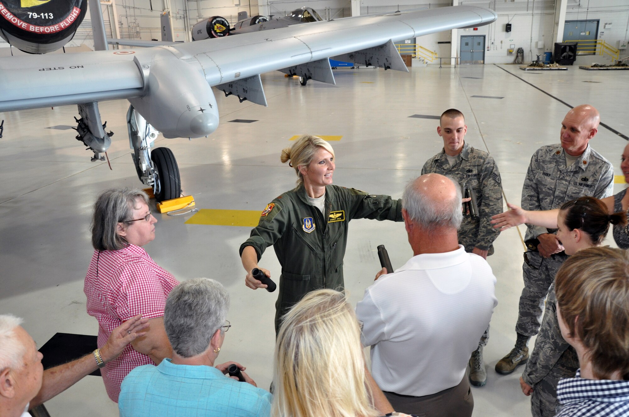 Maj. Audrey Orek talks to Whiteman Base Community Council members from Concordia and Cole Camp, Mo., during a tour the 442nd Fighter Wing and A-10 Thunderbolt II, Aug. 2, 2012. The 442nd Fighter Wing is an A-10 Thunderbolt II Air Force Reserve unit at Whiteman Air Force Base, Mo. The Base Community Council is a group of volunteer members from nearby communities dedicated to supporting Airmen. (U.S. Air Force photo/Tech. Sgt. Kent Kagarise)