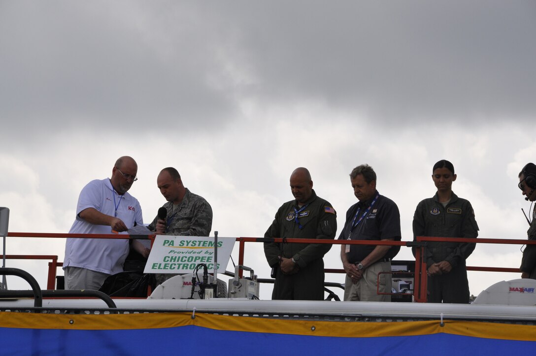 During the invocation given by Chaplain Longe, 439th Airlift Wing members bow their heads in respect during these opening ceremonies. The Air Show this year is the largest Westover has had since 1974, boasting more than 60 aircraft. (U.S. Air Force photo/MSgt. Andrew Biscoe)