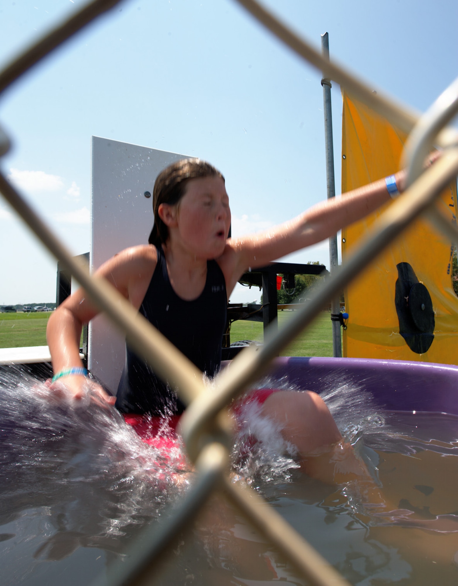 Ten-year-old Annabelle Jennings takes a dive in a dunk tank during the 2012 Langley-Eustis Appreciation Day at Langley Air Force Base, Va., Aug. 3, 2012. The event provided an opportunity for military personnel and family members from Langley and Eustis to enjoy food and a wide range of activities. (U.S. Air Force photo by Tech. Sgt. Barry Loo/Released)
