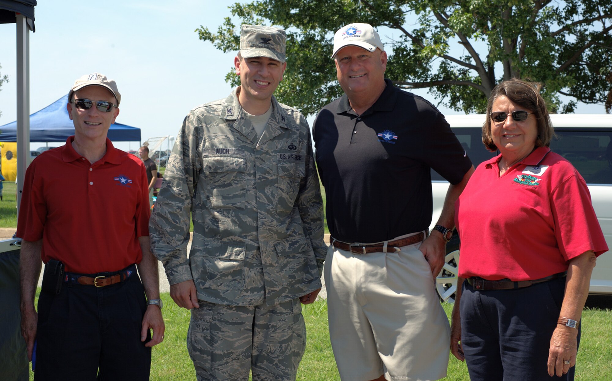 From left, Steve Hussell, Langley Civic Leader Association executive vice president, U.S. Air Force Col. Korvin Auch, 633rd Air Base Wing commander, Steve Mallon, Langley Civic Leader Association president, and Dale Drumright, Langley Civic Leader vice president of programs, pose for a photo during the 2012 Langley-Eustis Appreciation Day at Langley Air Force Base, Va., Aug. 3, 2012. The event provided an opportunity for military personnel and family members from Langley and Eustis to enjoy food and a wide range of activities. (U.S. Air Force photo by Tech. Sgt. Barry Loo/Released)
