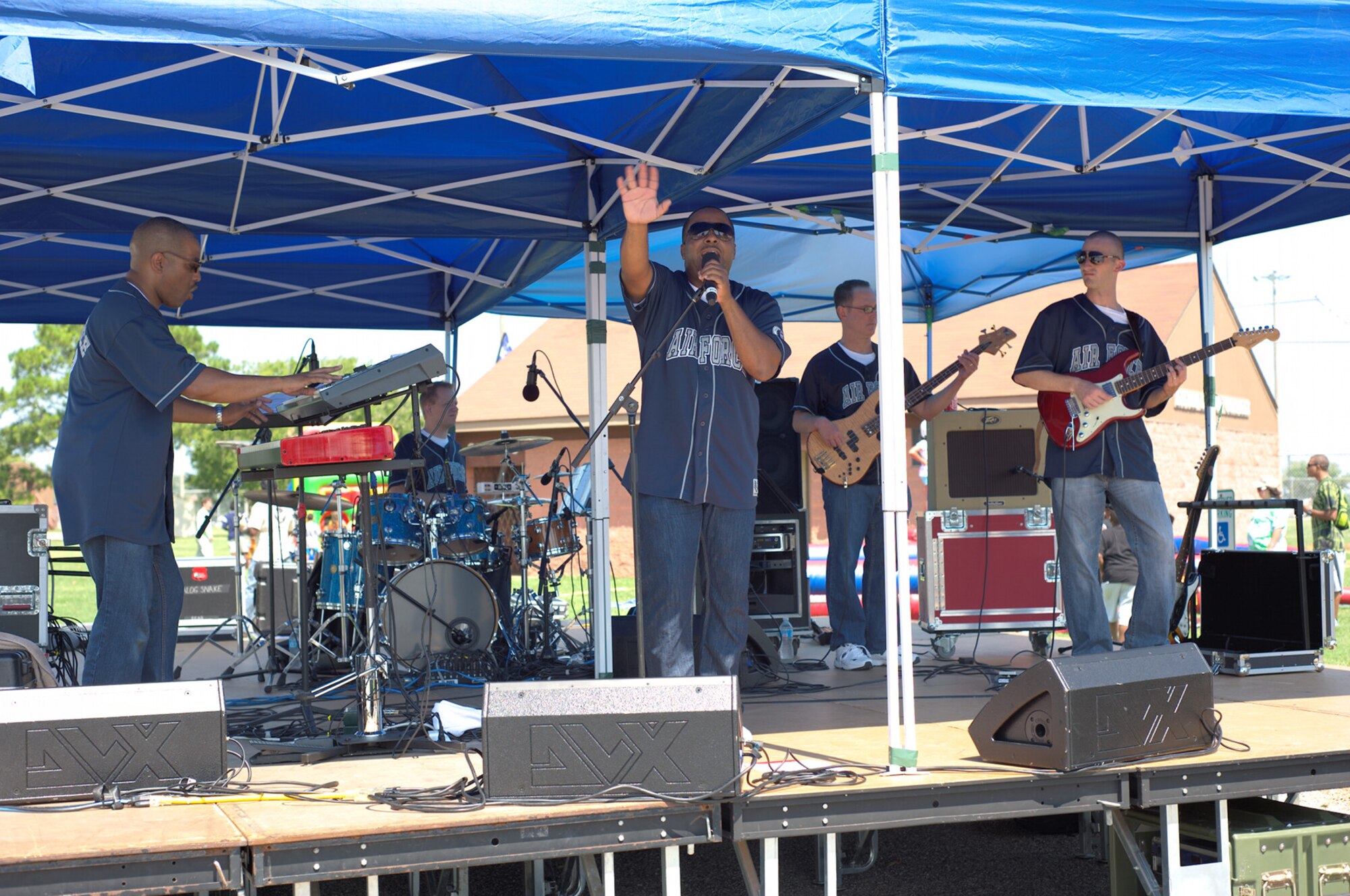 The Blue Aces Band performs for a live audience during the 2012 Langley-Eustis Appreciation Day at Langley Air Force Base, Va., Aug. 3, 2012. Agencies across the base joined forces to provide a day of food, fun and entertainment to thank military personnel for their daily contributions toward accomplishing the mission of Joint Base Langley-Eustis. (U.S. Air Force photo by Tech. Sgt. Barry Loo/Released)