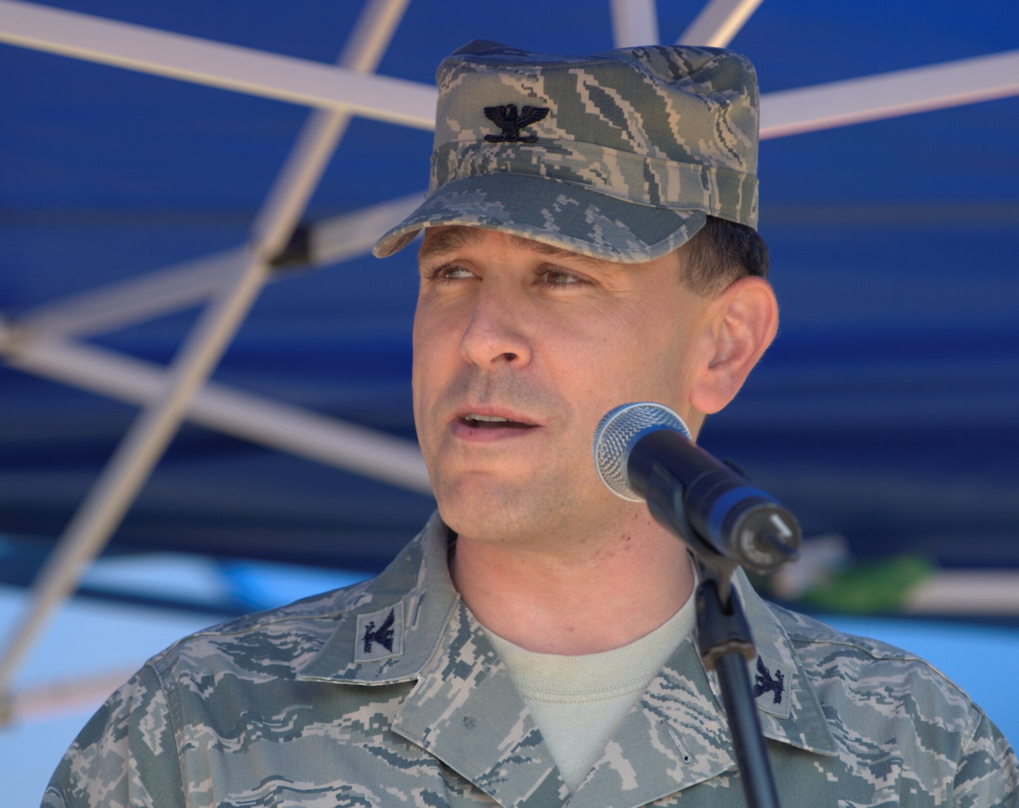 U.S. Air Force Col. Korvin Auch, 633rd Air Base Wing commander, delivers an opening speech during the 2012 Langley-Eustis Appreciation Day at Langley Air Force Base, Va., Aug. 3, 2012. Agencies across the base joined forces to provide a day of food, fun and entertainment to thank military personnel for their daily contributions toward accomplishing the mission of Joint Base Langley-Eustis. (U.S. Air Force photo by Tech. Sgt. Barry Loo/Released)